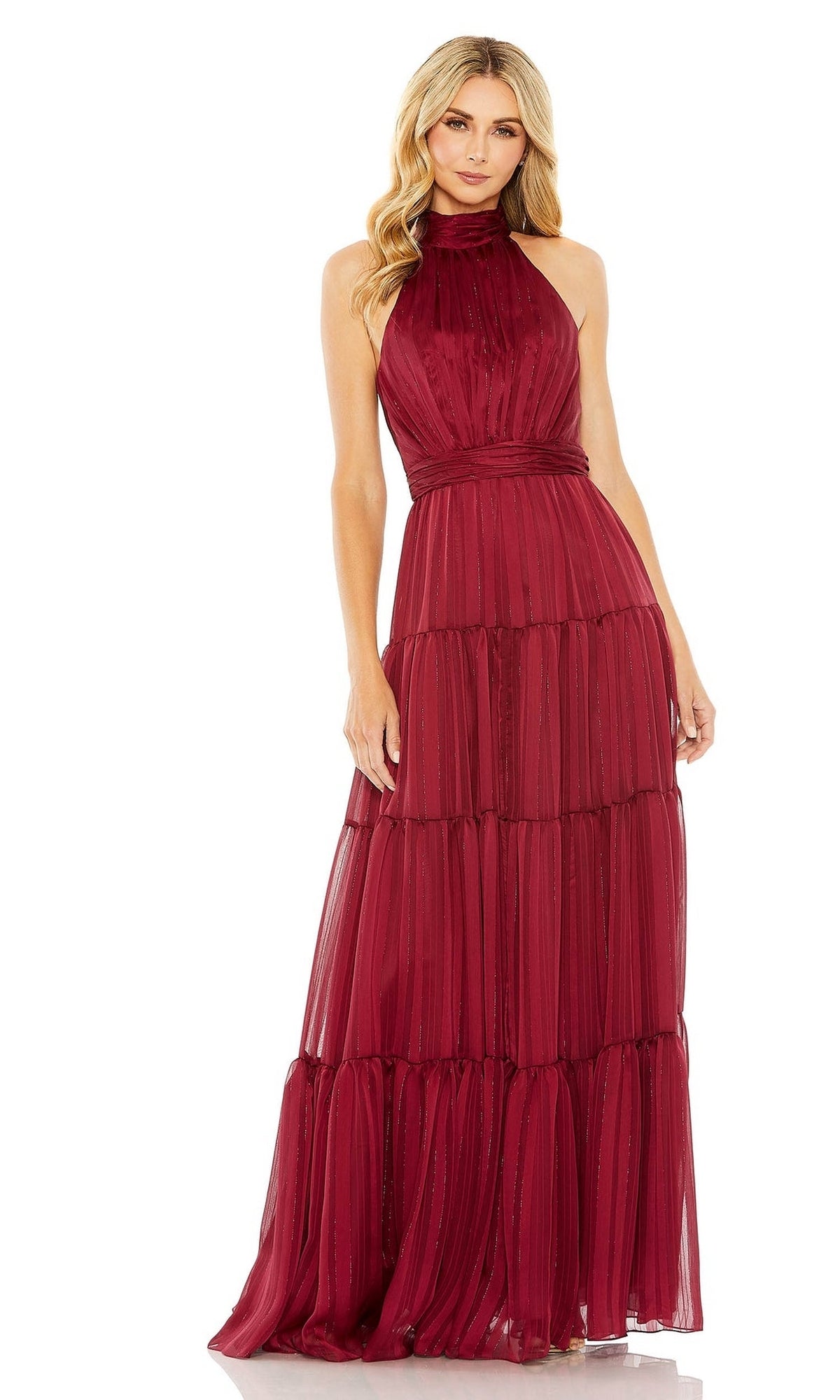 A woman wearing the Mac Duggal 49515 long black tiered formal dress with a high neckline, standing against a white background.