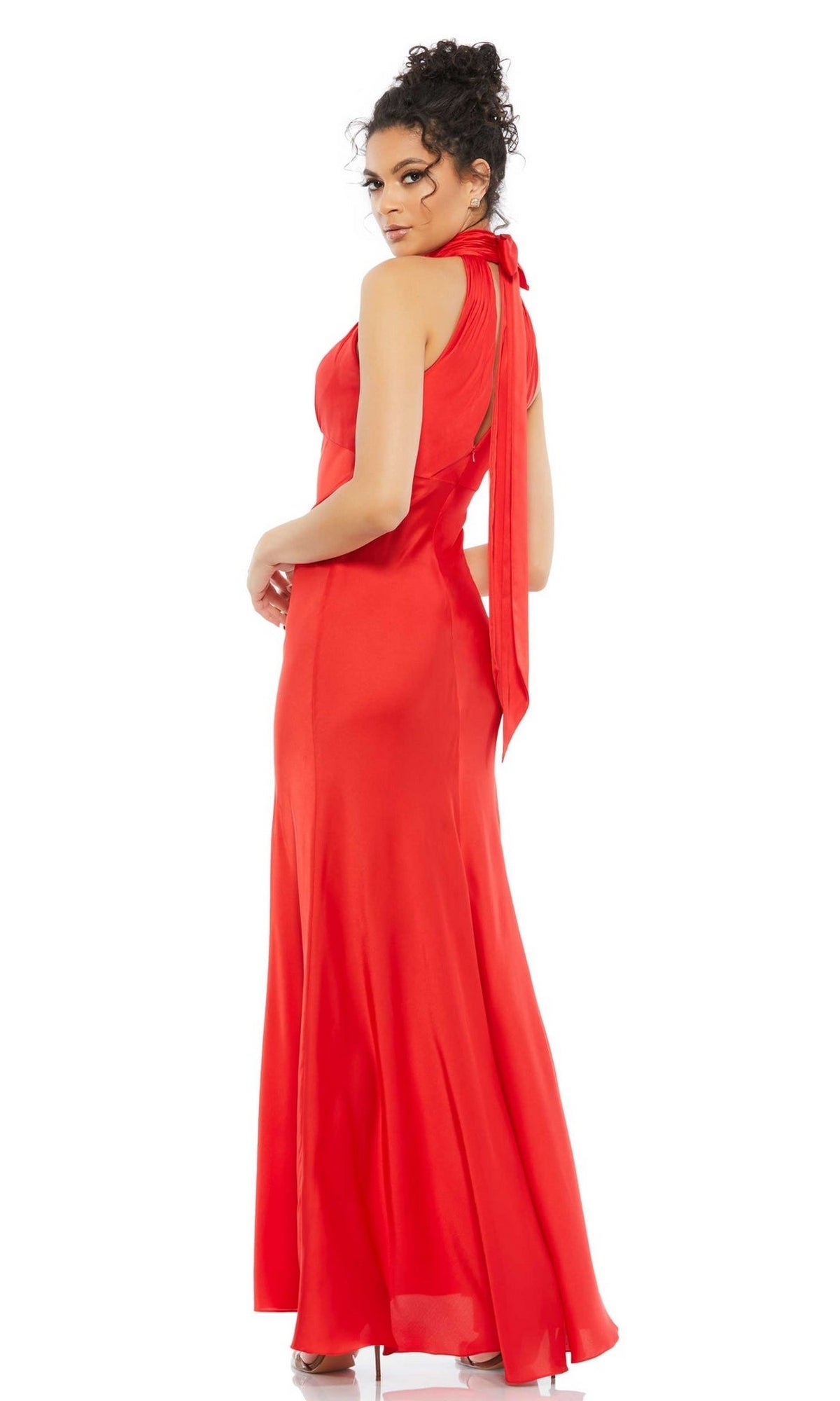 A woman models the Long Formal Dress 49520 by Mac Duggal—a sleeveless, floor-length red keyhole empire waist gown—standing with her back to the camera and looking over her shoulder against a plain white background.