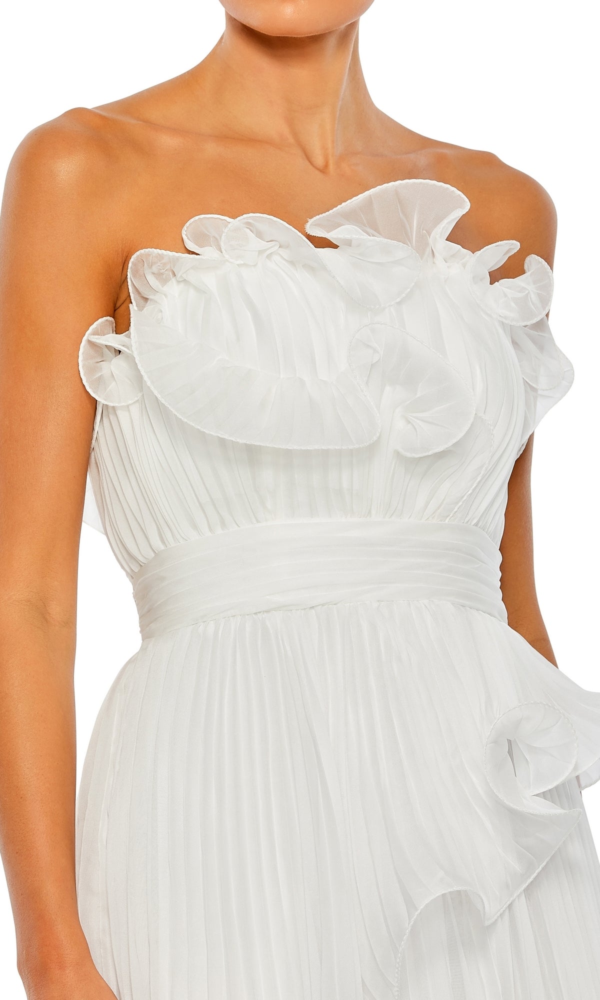 A woman wearing the Long Formal Dress 49537 by Mac Duggal, a strapless formal gown featuring an empire waist, pleated white fabric, and ruffled detailing on the bodice and waist.