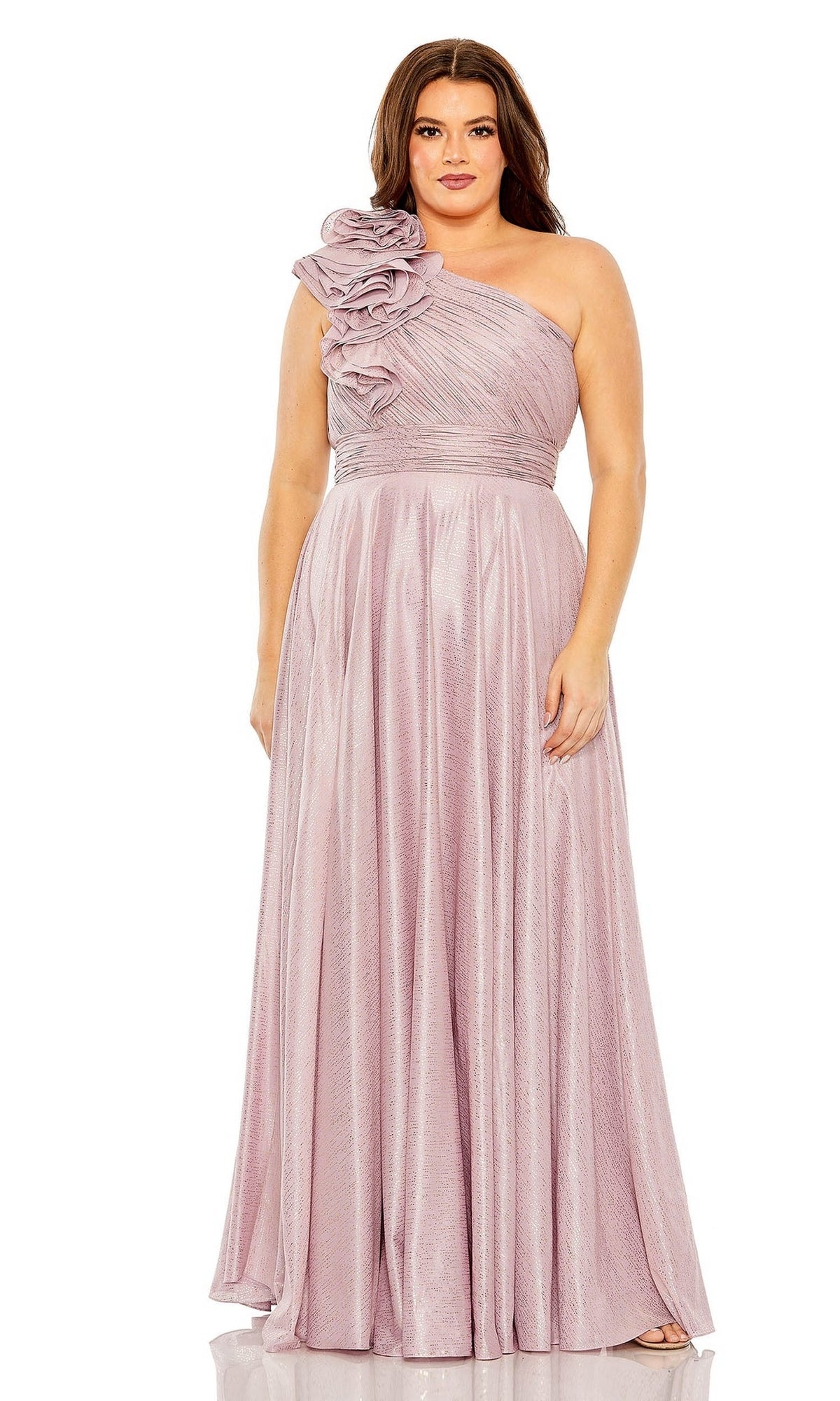 A woman models the Mac Duggal Plus-Size Lilac Formal Dress 49713W, featuring metallic chiffon fabric and a one-shoulder ruffle detail, standing against a white background.