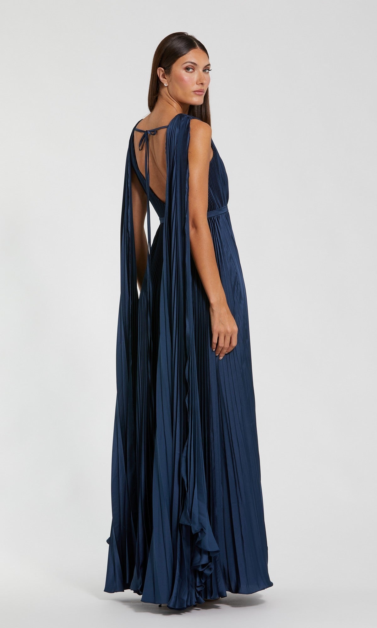 A woman wearing a Sage Green Long Formal Dress (Mac Duggal 49716) with elegant details stands against a plain light background.