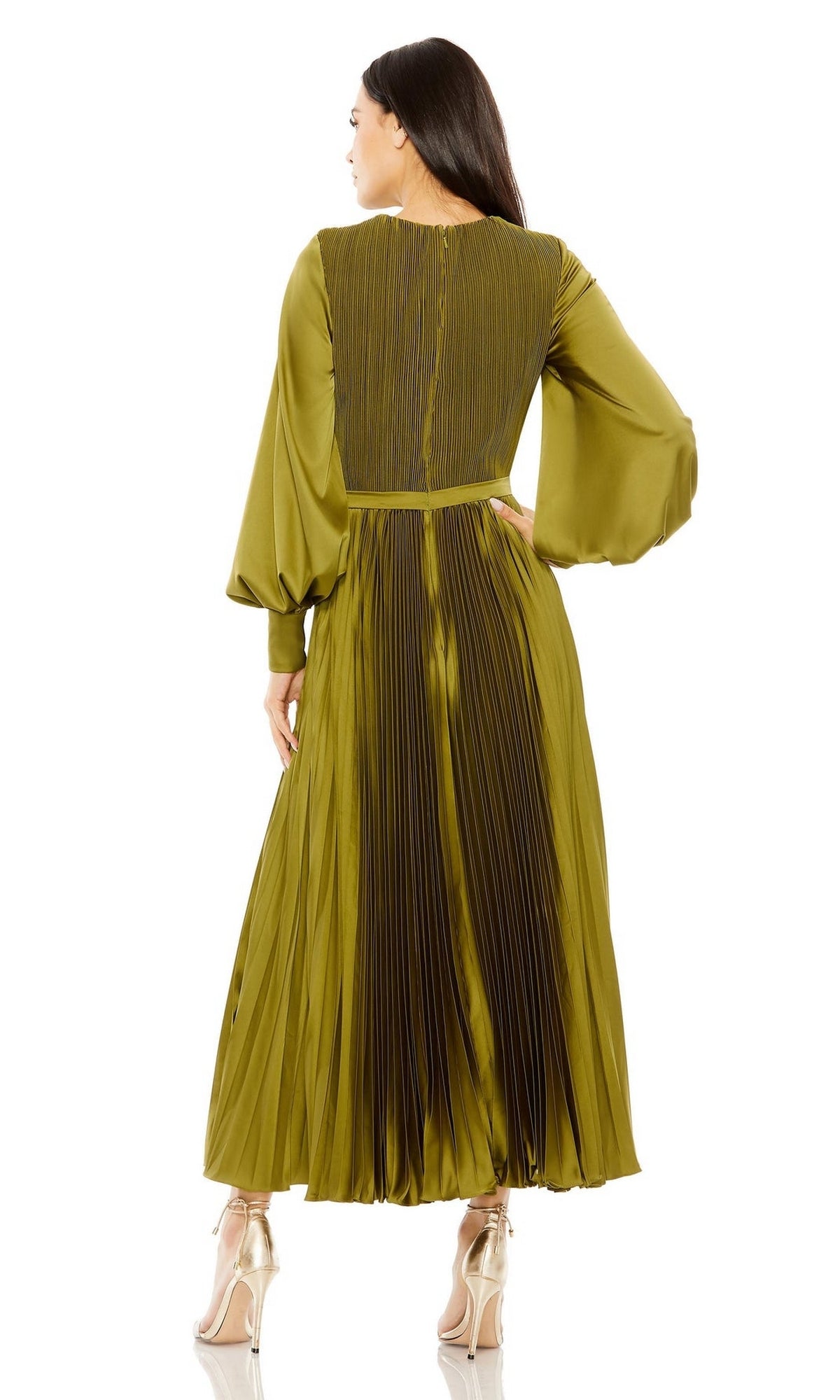 A woman, seen from the back, wears the Tea Length Formal Dress 49718 by Mac Duggal—an olive green pleated A-line design with a cinched waist—paired with gold high-heeled shoes.