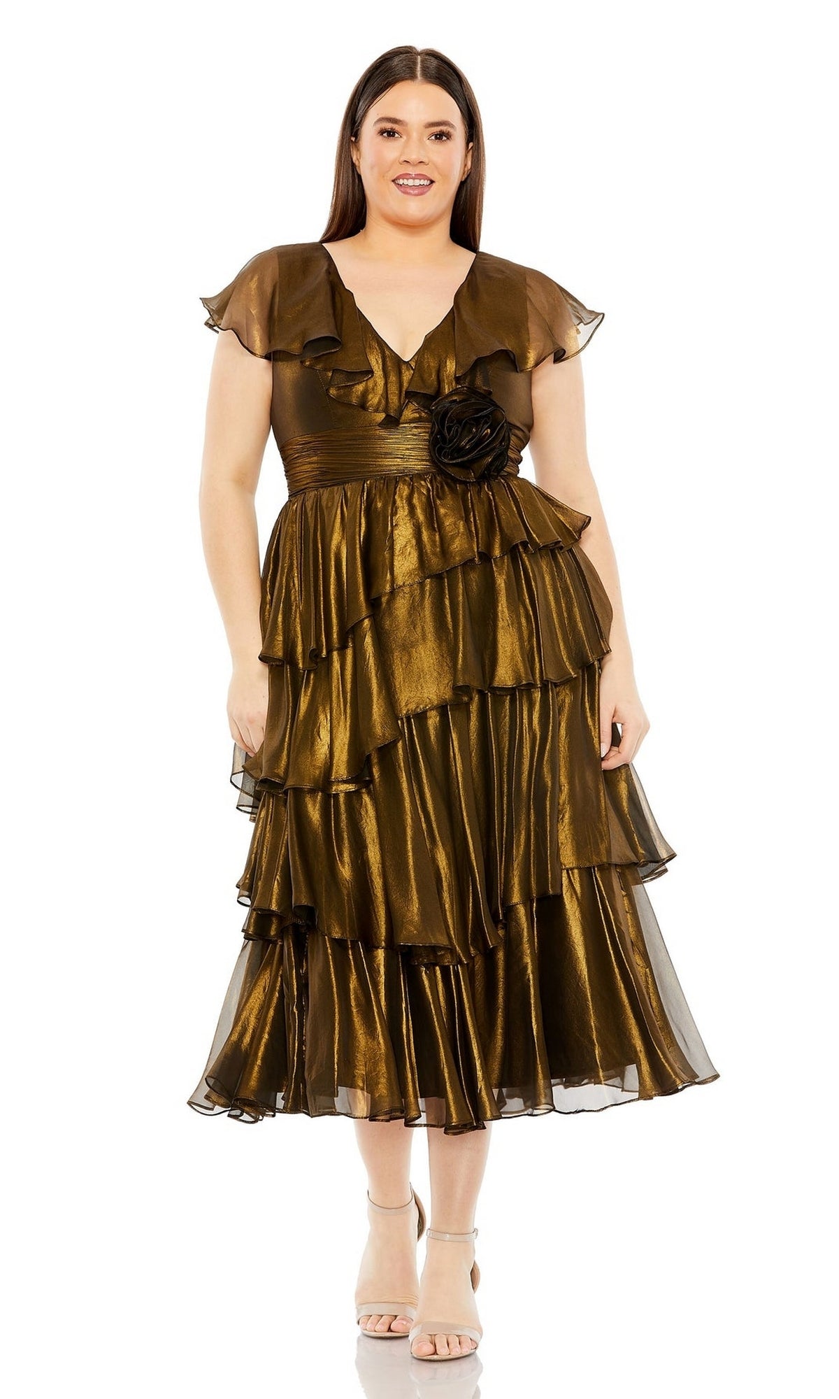 A woman wears the Plus-Size Short Gold Wedding-Guest Dress 49775W, featuring metallic gold tiers, short flutter sleeves, a floral waist accent, and neutral heels, standing against a plain white background.