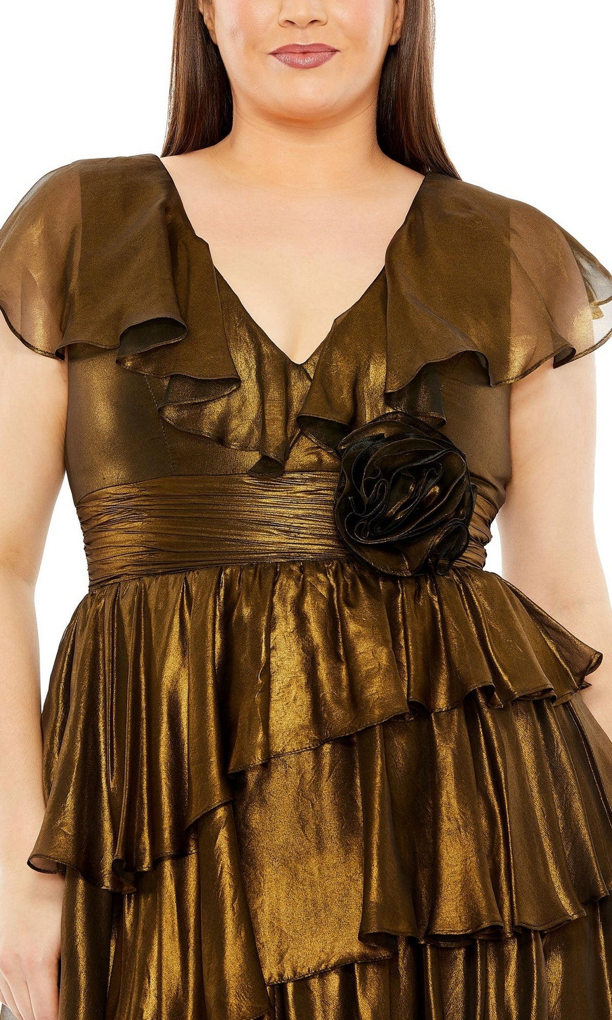 A person wearing a Plus-Size Short Gold Wedding-Guest Dress 49775W with a shiny finish, ruffled design, sheer short sleeves, and a large fabric flower at the waist.