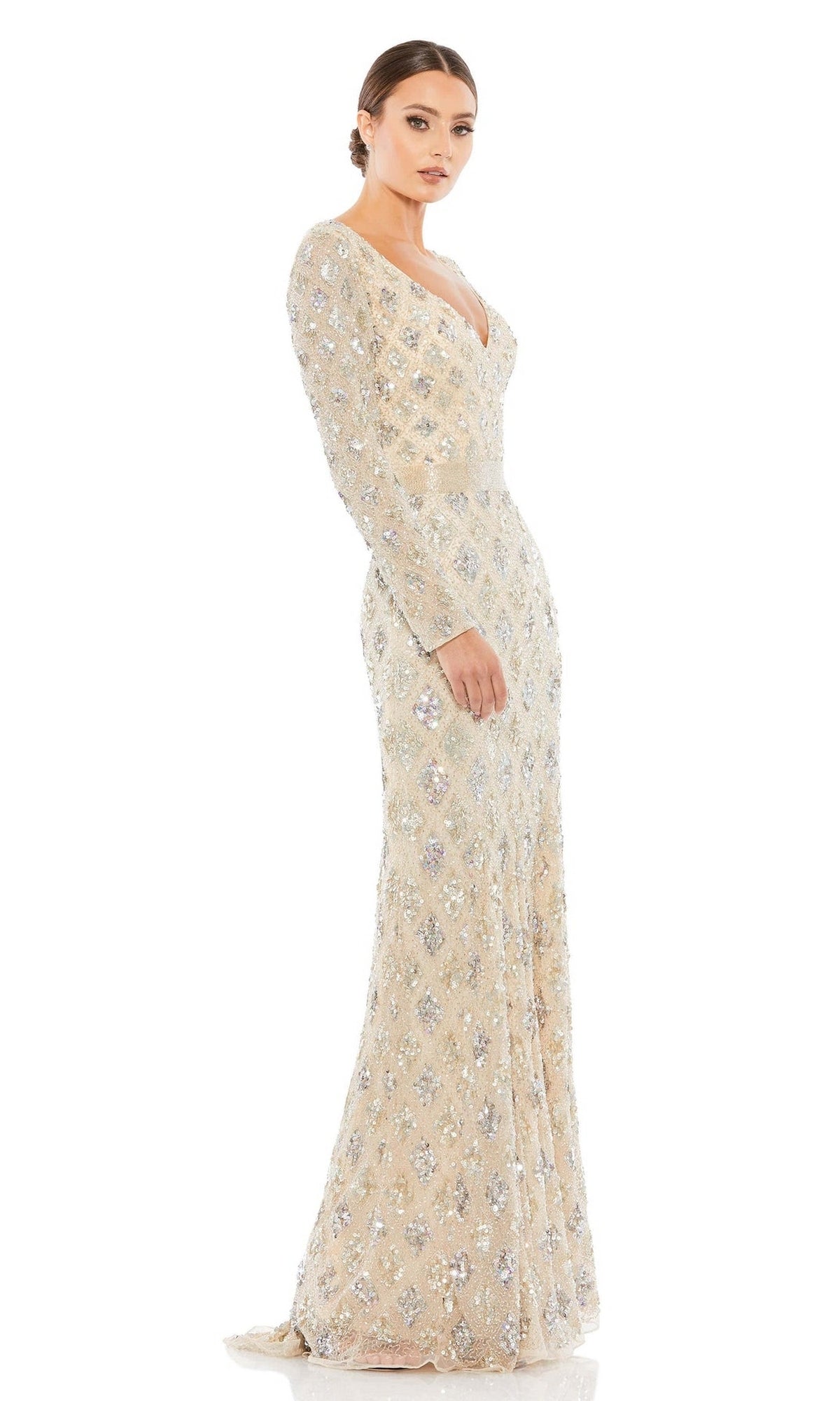 Woman wearing the Mac Duggal 5021 Long Sleeve Beaded Formal Dress, a fitted cream gown with silver sequin embellishments and a deep V neckline, perfect for mother of the bride, standing against a white background.