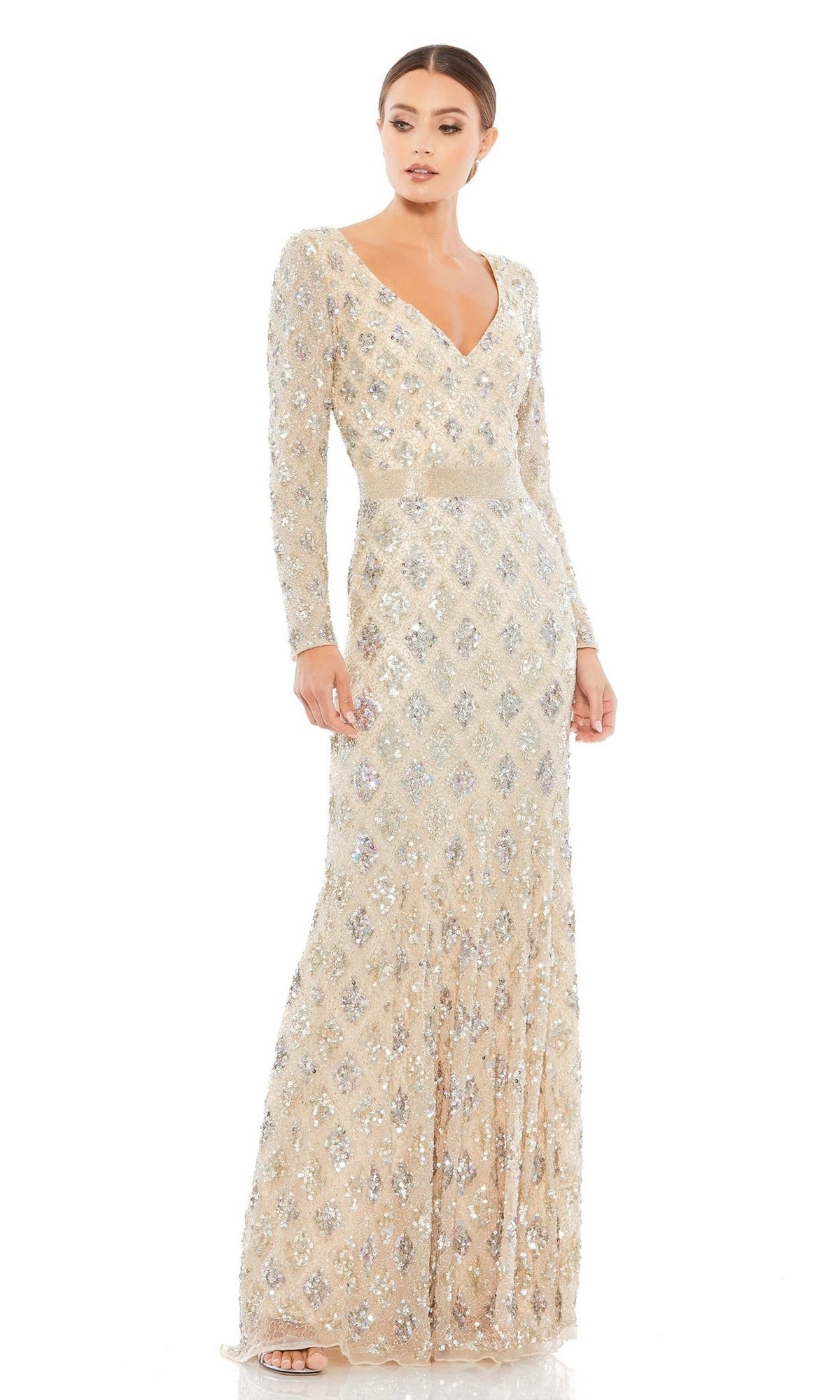 A woman models the Mac Duggal 5021, a long sleeve beaded formal dress with silver sequin embellishments—an elegant evening gown ideal for any mother of the bride, photographed against a white background.