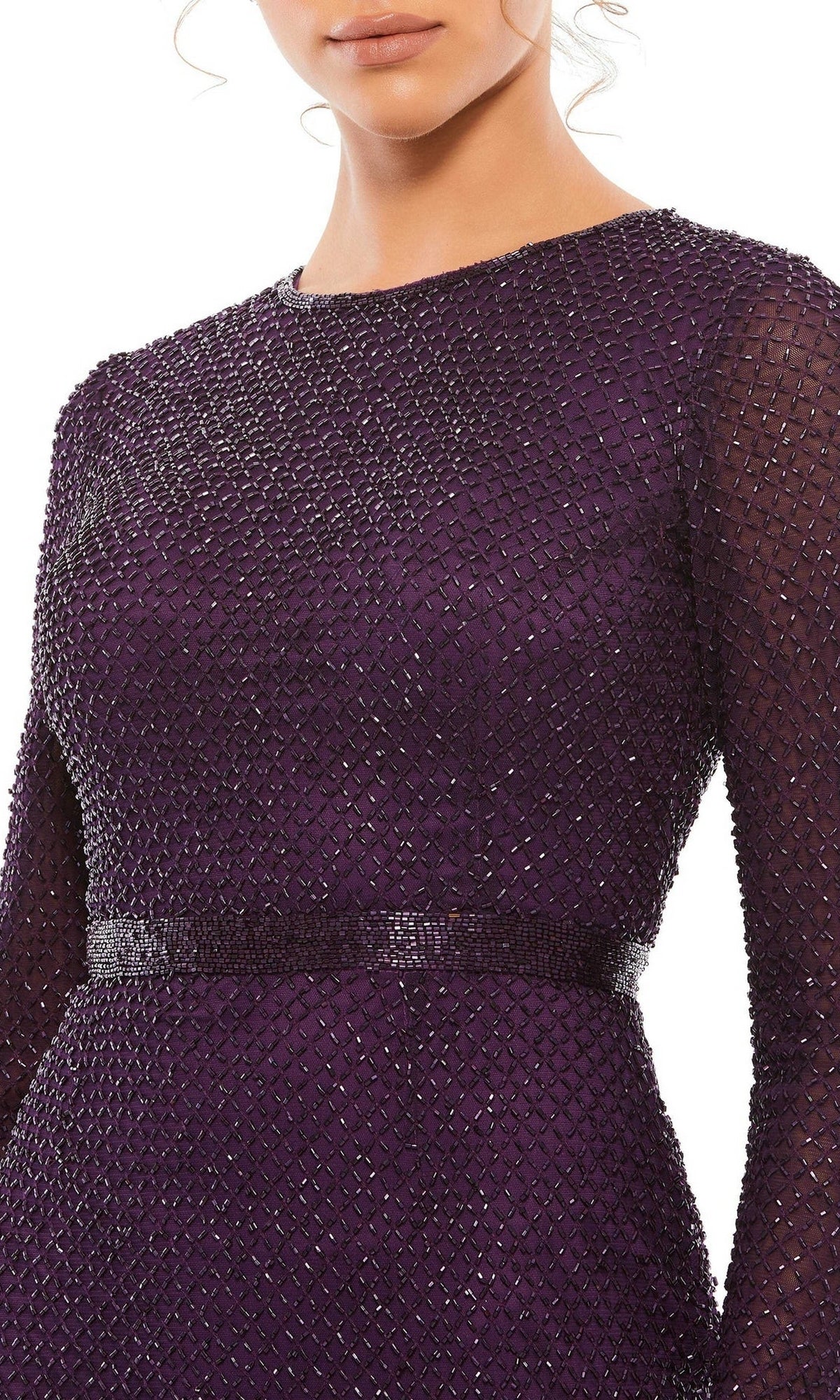 A woman wears the Long Formal Dress 5056 by Mac Duggal, a dark purple, textured long sleeve dress with a fitted waist and high neckline, shown from shoulders to hips.
