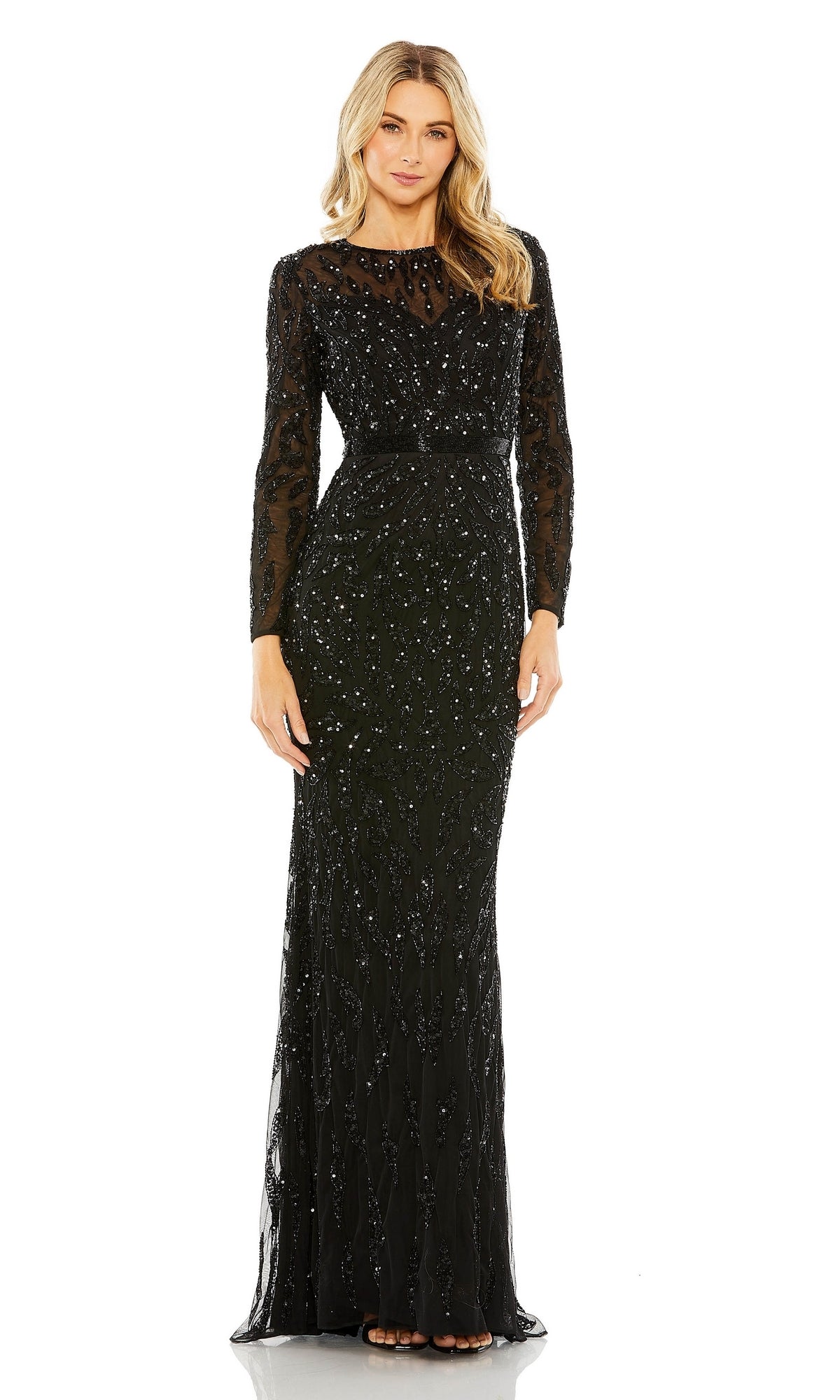 A woman wears the Mac Duggal 5124 Long Sleeve Sequin Formal Dress—an elegant, modest evening gown with sheer sleeves and shimmering sequin embellishments.