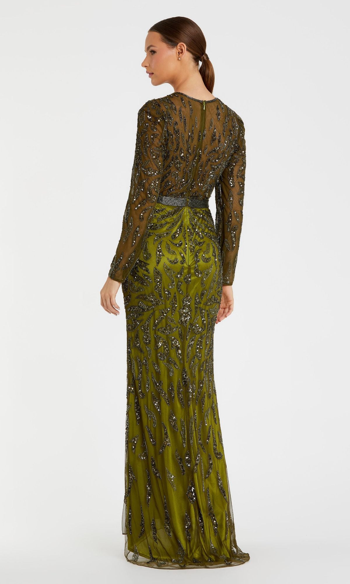 A woman faces away, wearing the Mac Duggal 5124 Long Sleeve Sequin Formal Dress in olive green with black and silver beaded details, set against a plain white background.