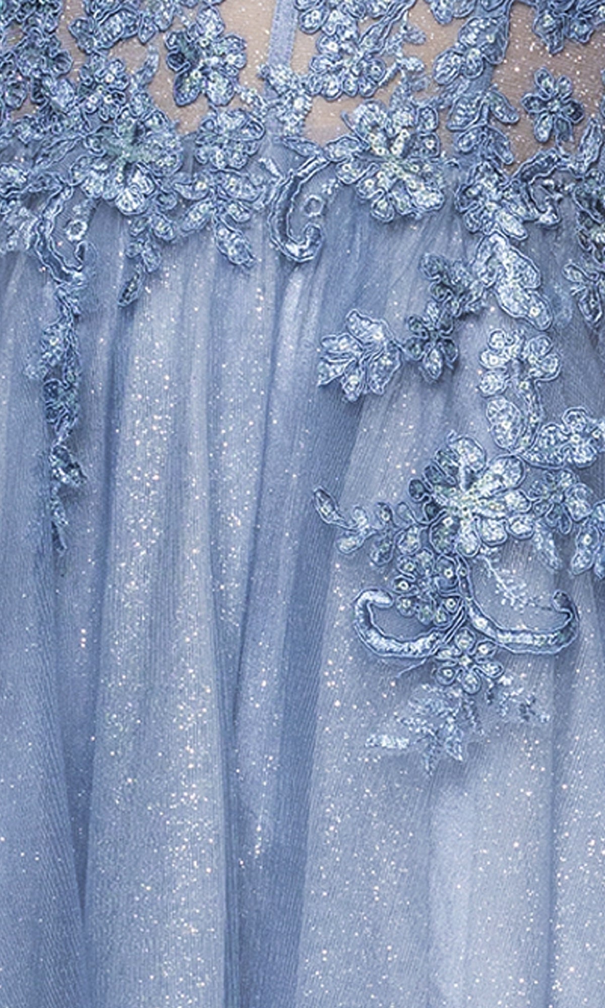 Close-up of the Blondie Nites 5311BN long prom dress in light blue glitter tulle, featuring floral lace appliqués and a corset bodice for an elegant, feminine look.