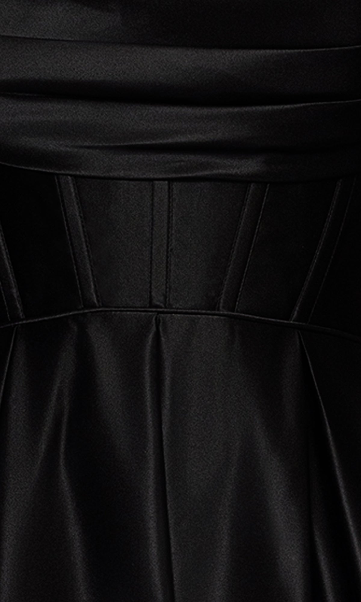 Close-up of the Long Black A-Line Prom Dress: Blondie Nites 5333BN in satin, featuring pleated and panel seam details at the waist.