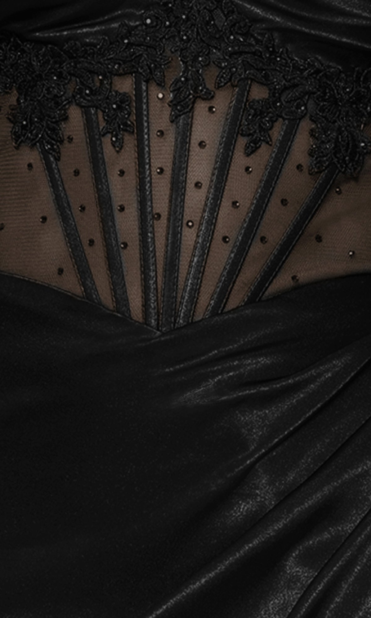Close-up of the Strapless Black Prom Dress: Blondie Nites 5434BN, showcasing black satin fabric with a sheer mesh panel, black embroidered lace, vertical lines, and delicate beaded embellishments.