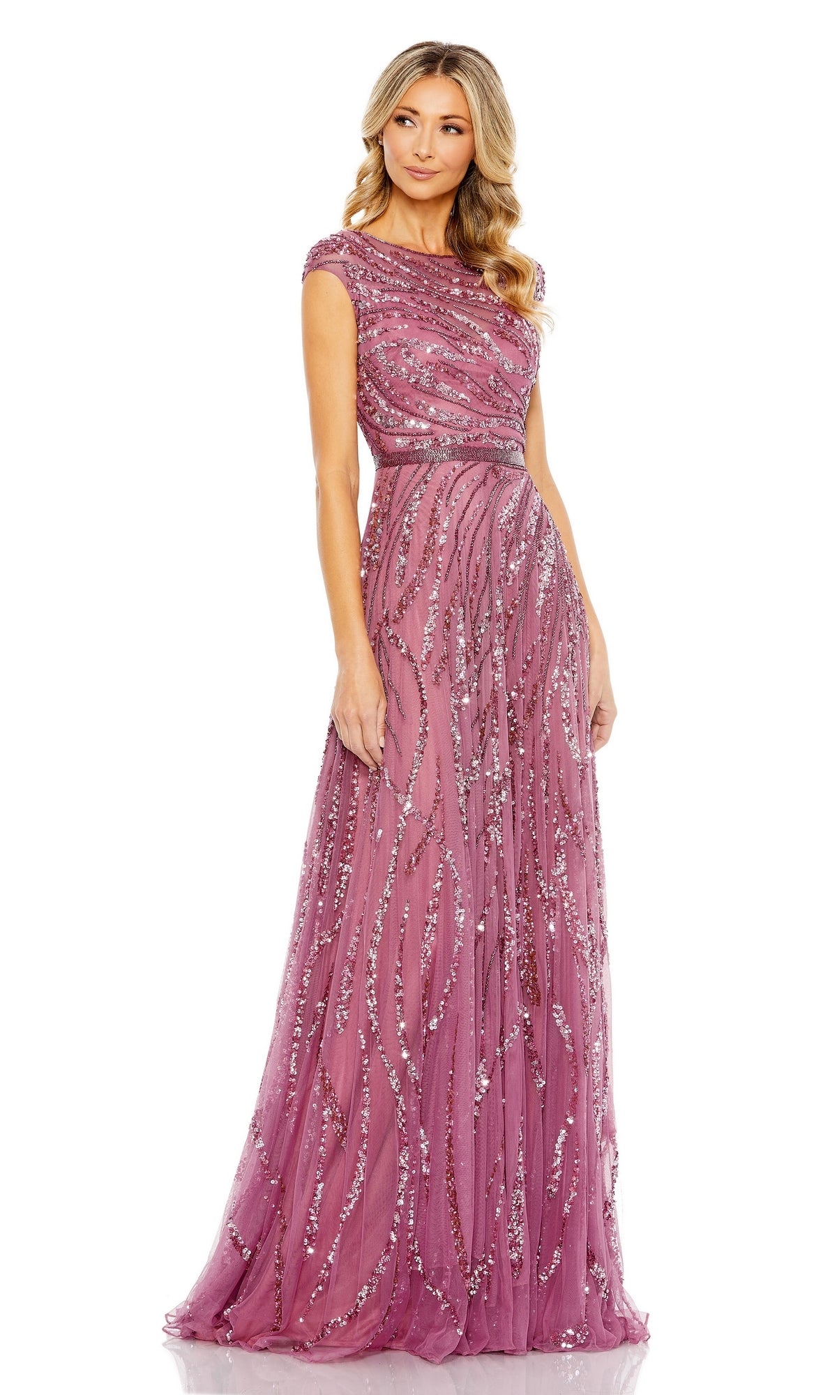 A woman wears the Mac Duggal 5445 High-Neck Beaded Formal Gown, a floor-length mauve dress with cap sleeves and wavy silver sequin embellishments, posed against a plain white background.
