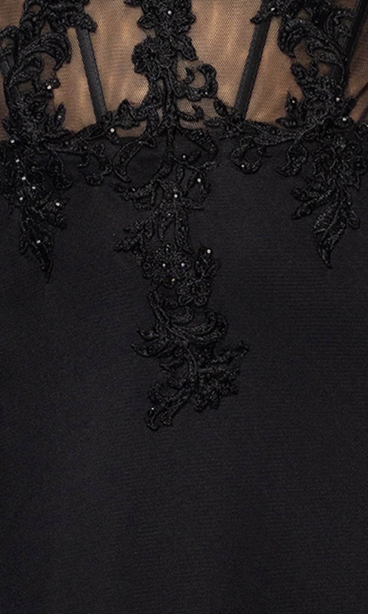 Close-up of the Black Long Prom Dress Blondie Nites 5464BN, a mermaid gown with a sweetheart neckline, sheer lace appliques, and bead detailing at the top.