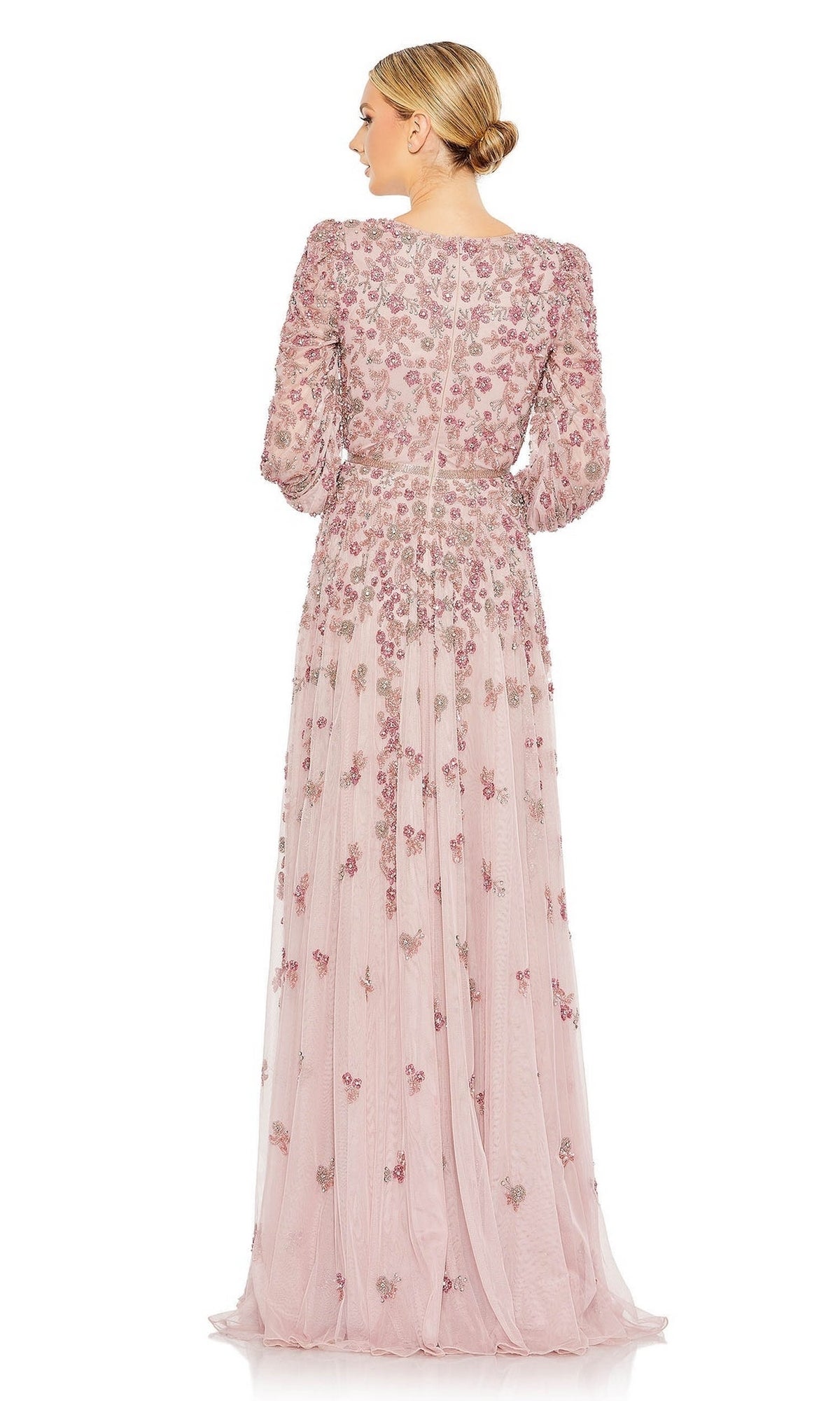 A woman stands with her back to the camera against a white background, wearing the Mac Duggal 5497 Long Sleeve Beaded Formal Dress in pale pink with floral embroidery.
