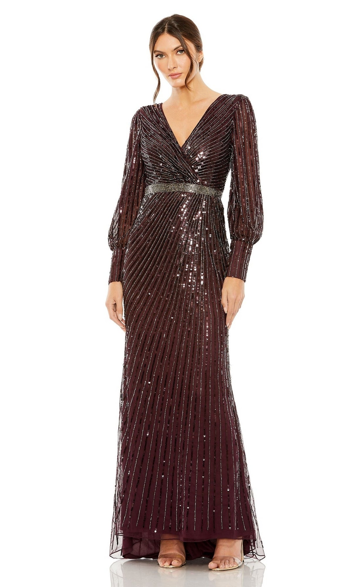 A woman wearing the Mac Duggal 5501 long sleeve sequin formal dress with a V-neckline and diagonal stripes in deep burgundy, ideal for the mother of the bride, stands against a white background.