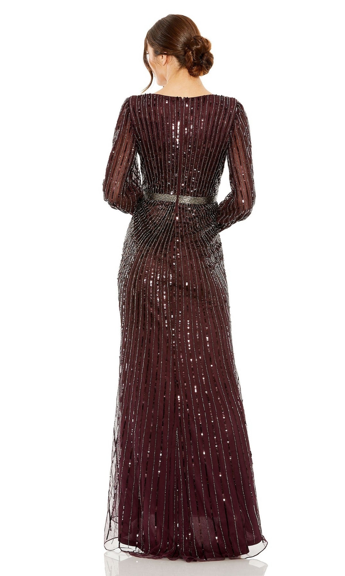 A woman with brown hair in a low bun models the Mac Duggal 5501—a long-sleeve, floor-length sequin formal dress in dark burgundy—shown from the back, perfect for mothers of the bride or any formal occasion.