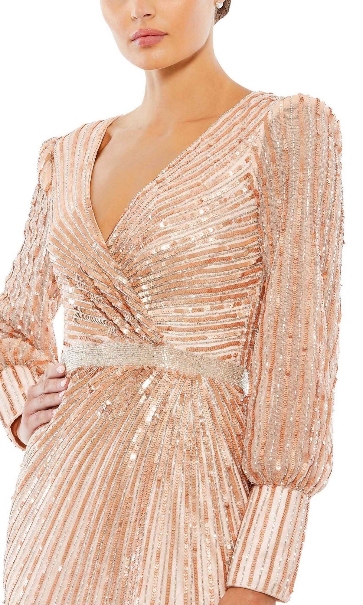 Woman wearing the Mac Duggal 5501 long sleeve sequin formal dress in blush pink, featuring metallic sequins and a deep V-neckline—an elegant choice for evening events or the mother of the bride.