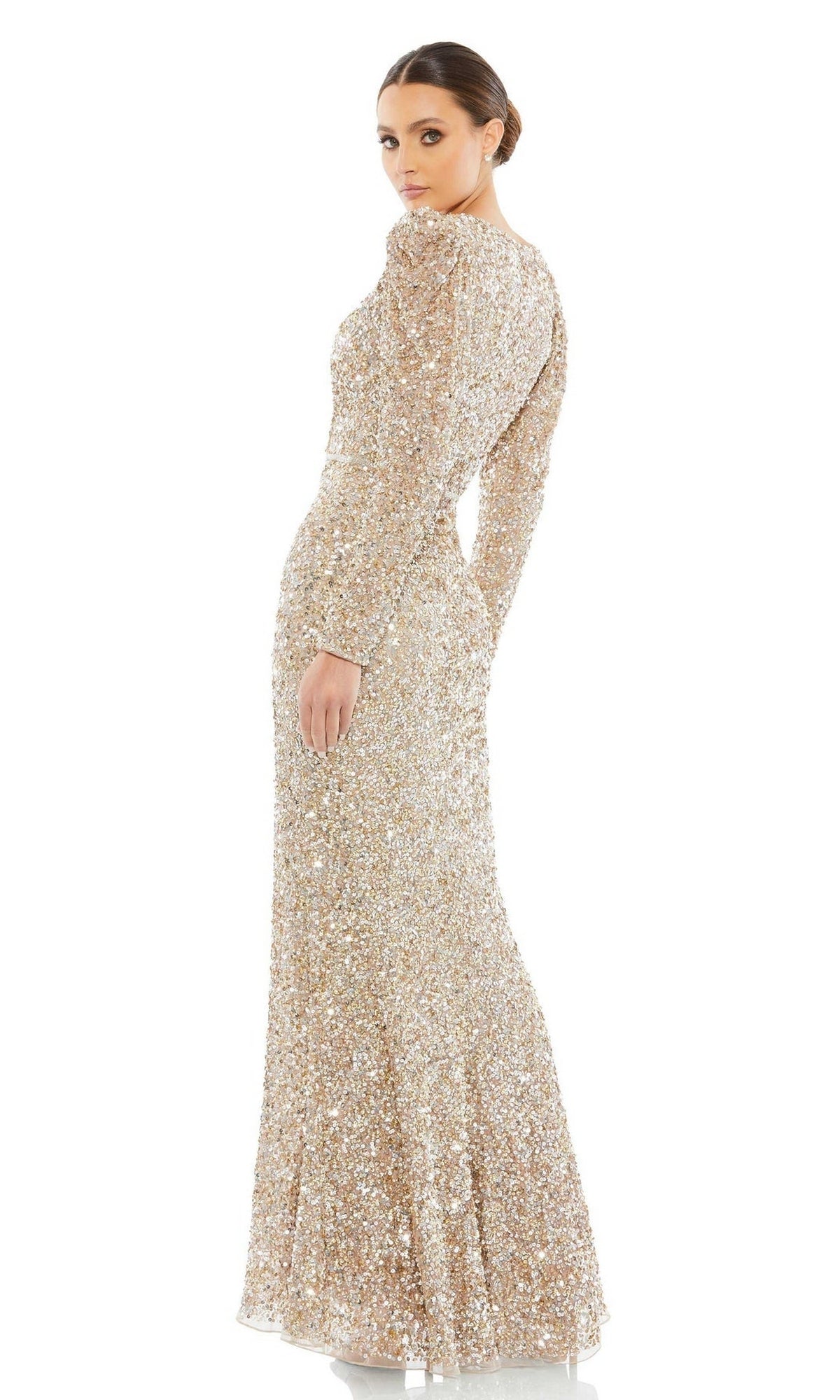 A woman in the Mac Duggal 5510 Long Sleeve Sequin Formal Dress stands with her back turned, looking over her shoulder.