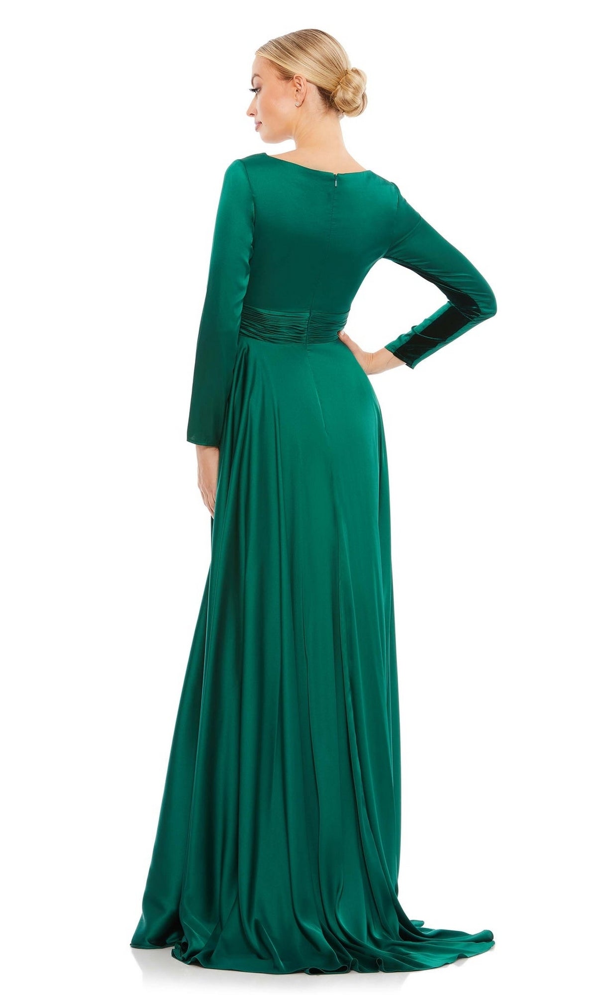 A woman with her hair in a low bun is seen from behind, wearing the Mac Duggal 55245 Long Sleeve Long Formal Dress in green, featuring a fitted waist, flowing floor-length skirt, and elegant A-line silhouette.