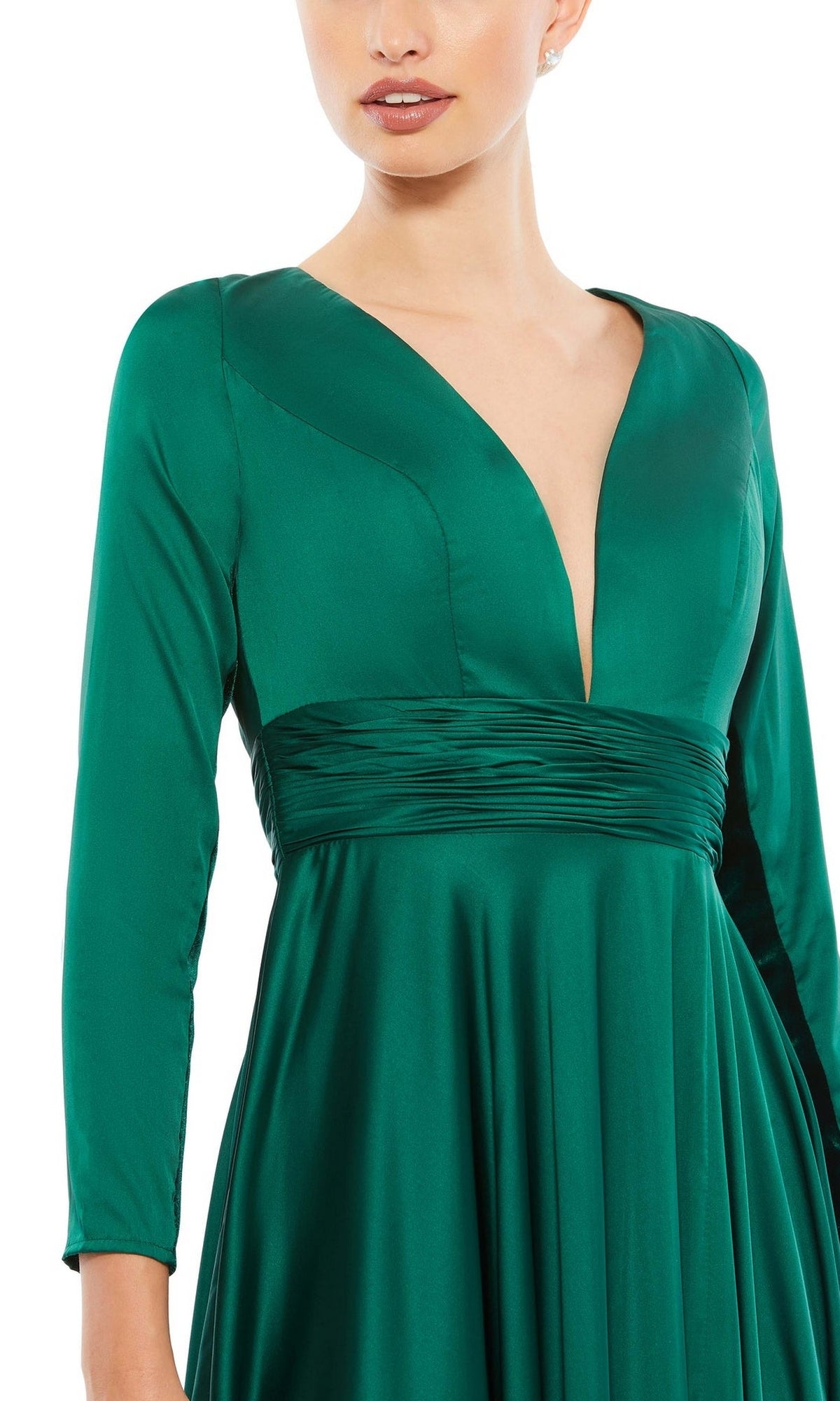 Woman in a deep green satin Mac Duggal 55245 long sleeve formal dress, featuring a deep V-neckline, ruched waistband, and elegant A-line silhouette—perfect for evening events.