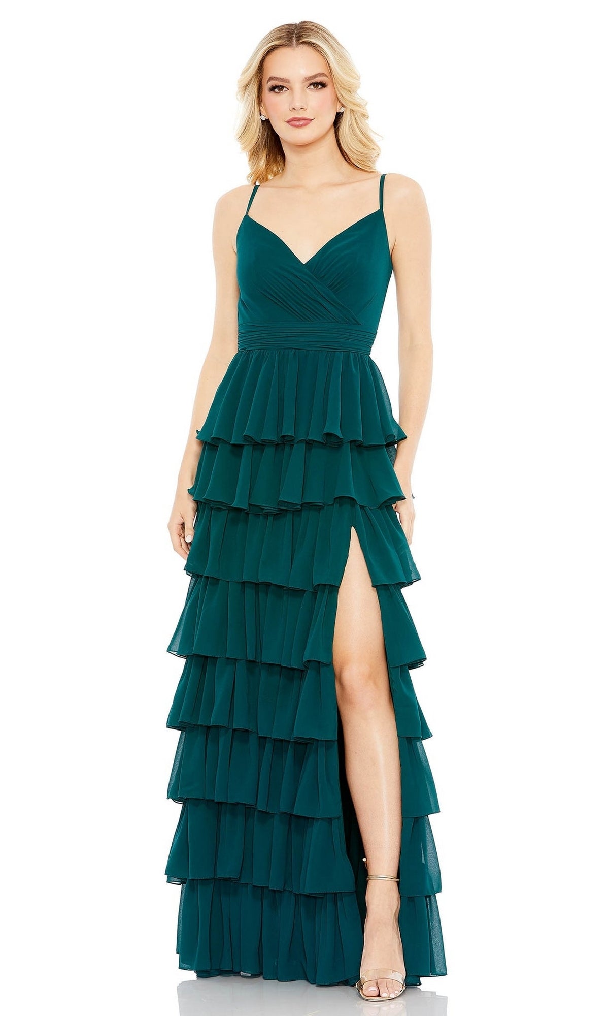 A woman models the Mac Duggal 55416, a sleeveless dark teal ruffled long A-line prom dress with spaghetti straps, fitted bodice, tiered skirt, and high side slit, against a plain white background.