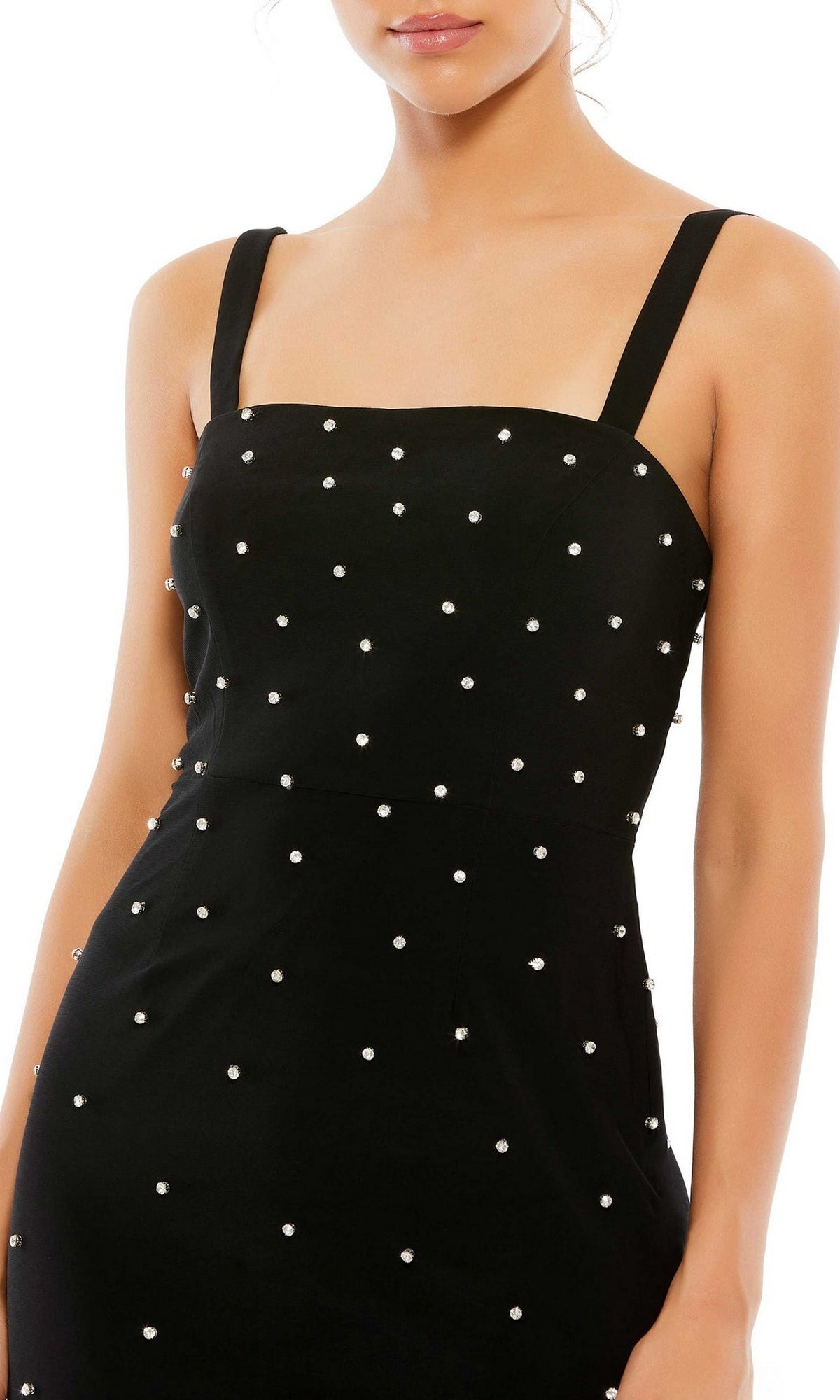 A woman wearing the Short Homecoming Dress 55644 by Mac Duggal—a fitted black party dress with thin straps and evenly spaced small white pearl embellishments.