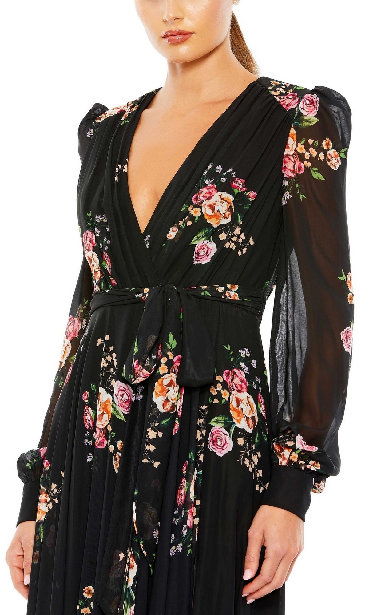 Woman wearing the Mac Duggal 55661 Long Black Print Formal Dress—a long-sleeve, V-neck, floral-print gown with waist tie, perfect for any formal evening occasion.