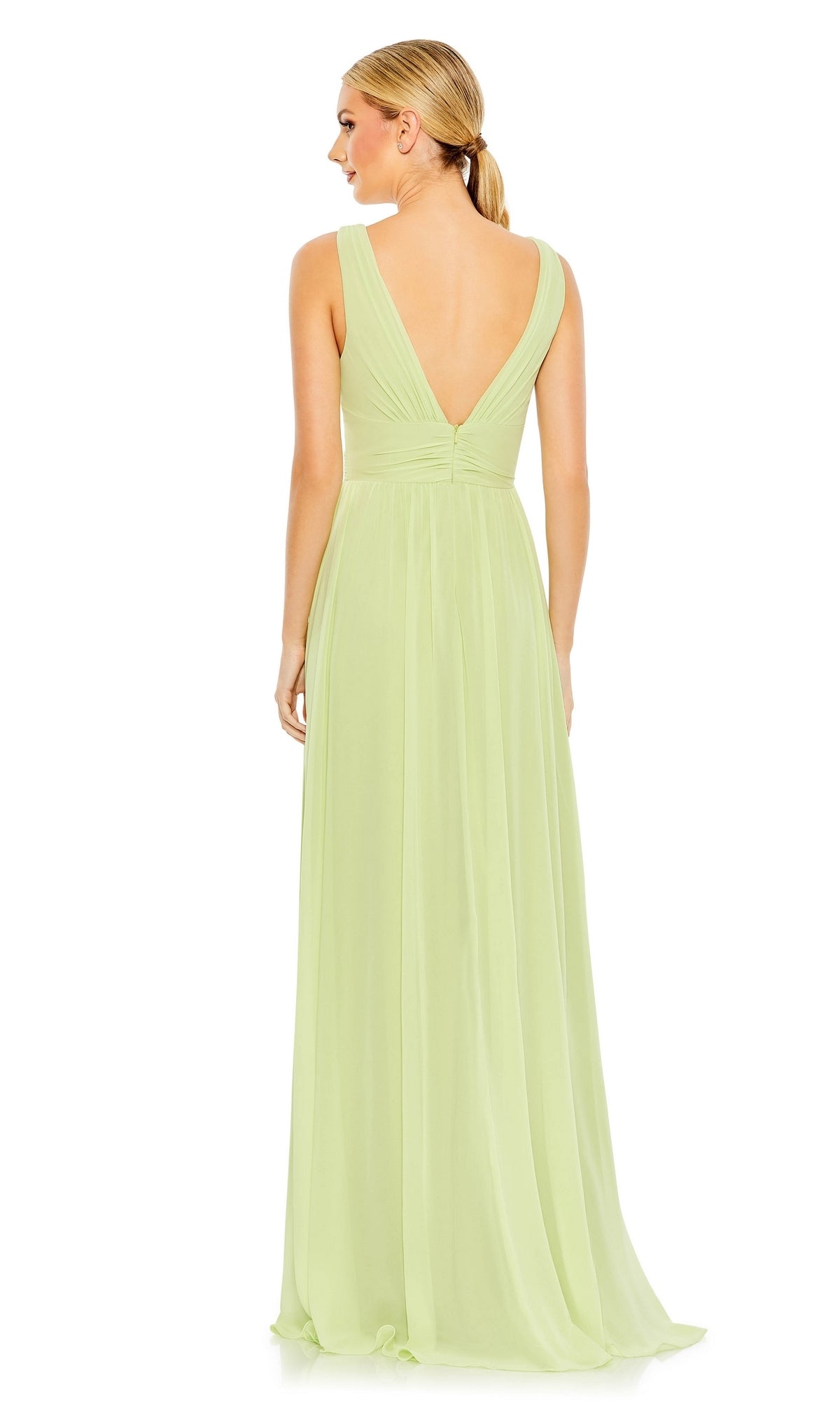 A woman faces away, wearing the Lime Green Long A-Line Prom Dress with Slit 55793—an elegant, floor-length sleeveless gown featuring gathered waist details and a deep V-back.