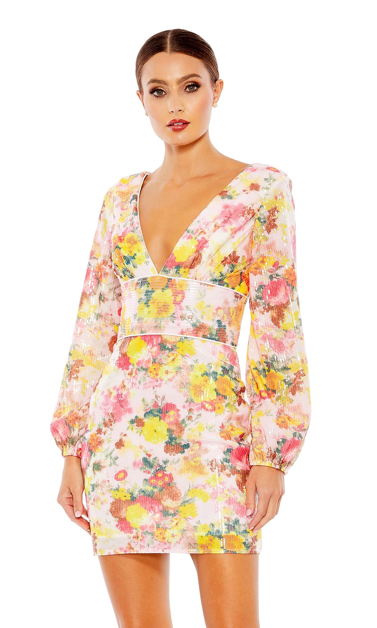 Woman wearing the Floral-Sequin Long Sleeve Short Party Dress 55798, featuring a V-neck and vibrant pink, yellow, and green floral pattern, posing against a white background.