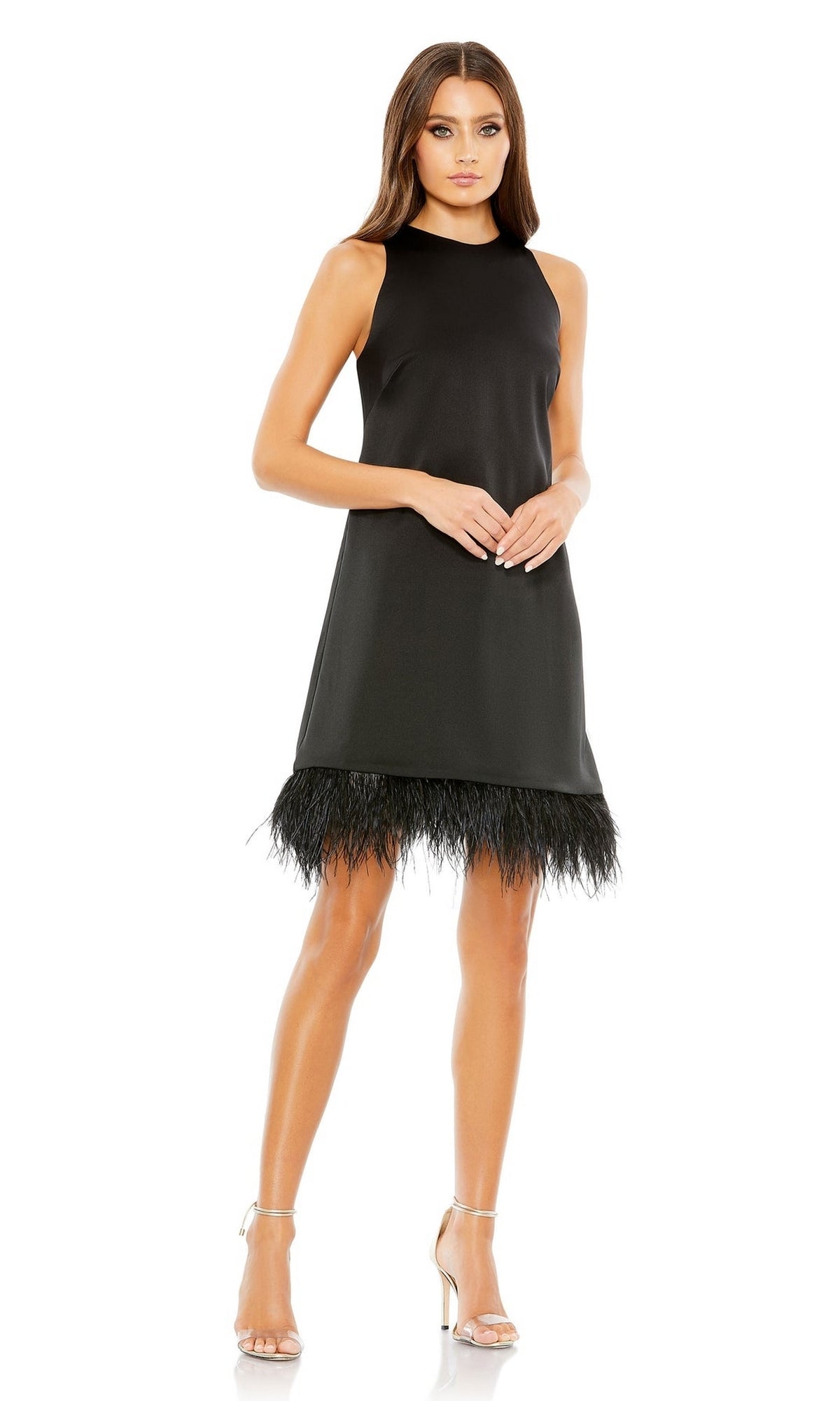 Woman in the Mac Duggal 55805 Short Sheath Wedding Guest Dress—sleeveless, black with a feathered trim hemline—styled with silver high-heeled sandals against a white background; an elegant choice for any wedding guest.