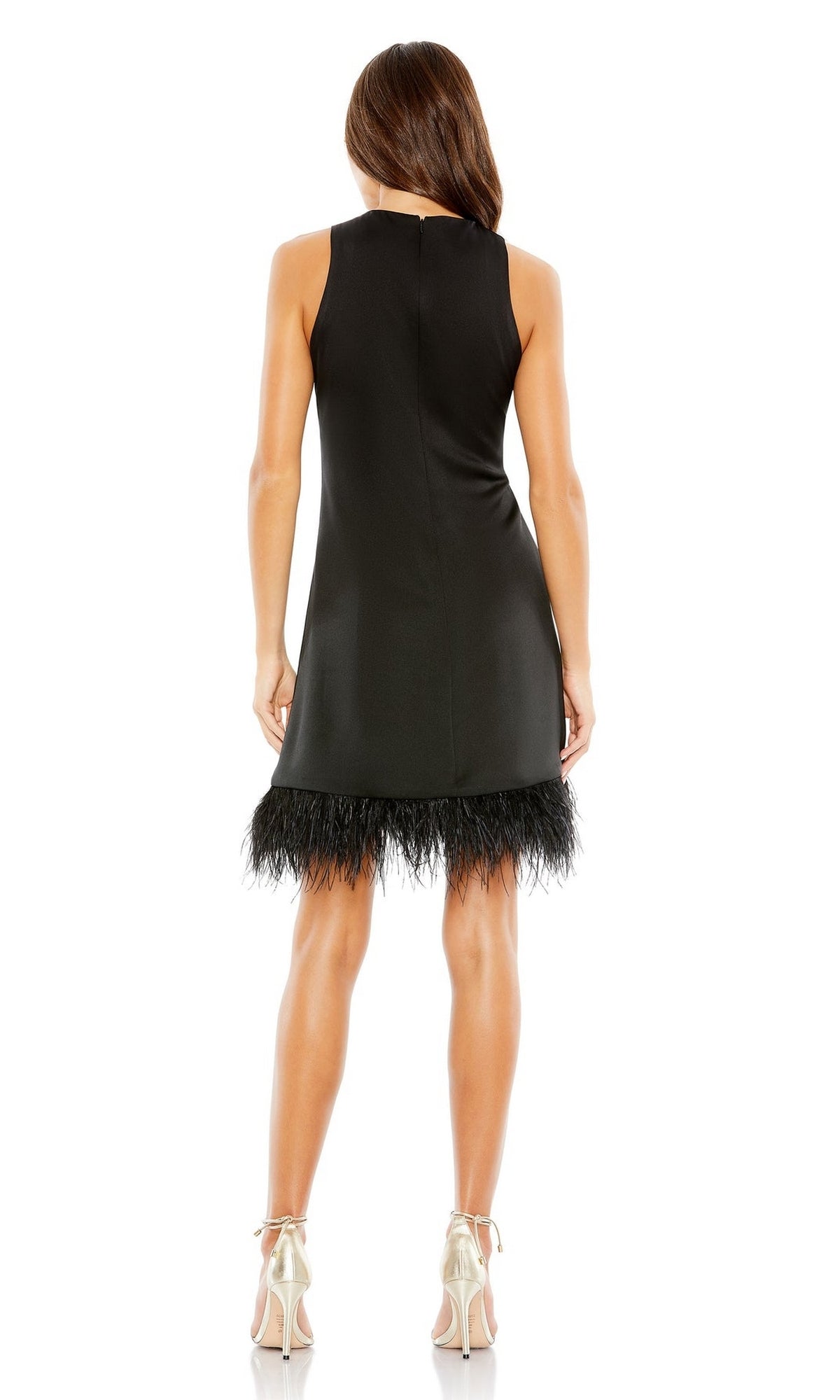 Woman stands with her back to the camera, wearing the Mac Duggal 55805 Short Sheath Wedding Guest Dress with feathered hem and metallic heels—a chic choice for any wedding celebration.