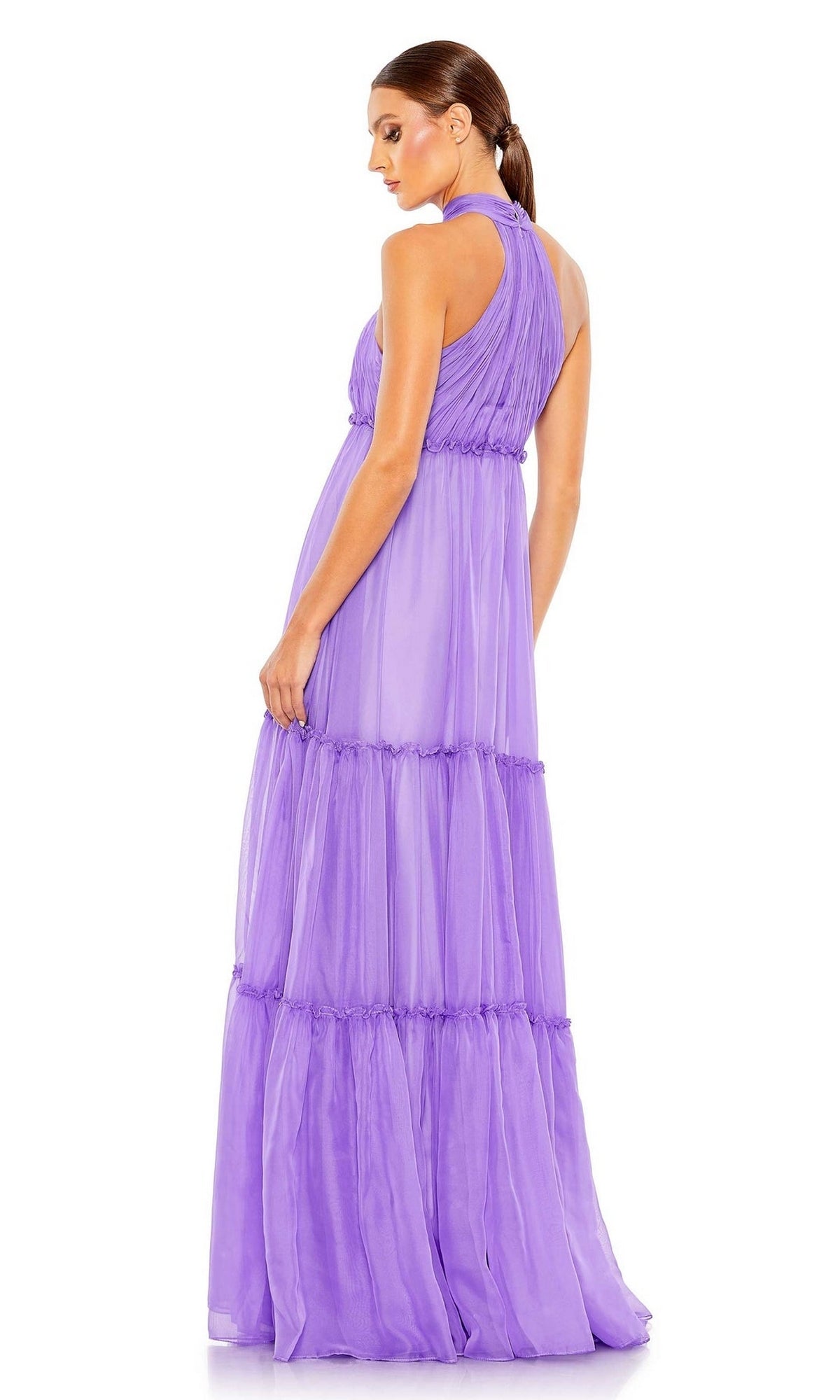 A woman stands facing away, looking over her shoulder, modeling the Mac Duggal 55848 High-Neck Long Formal Dress against a plain white background.