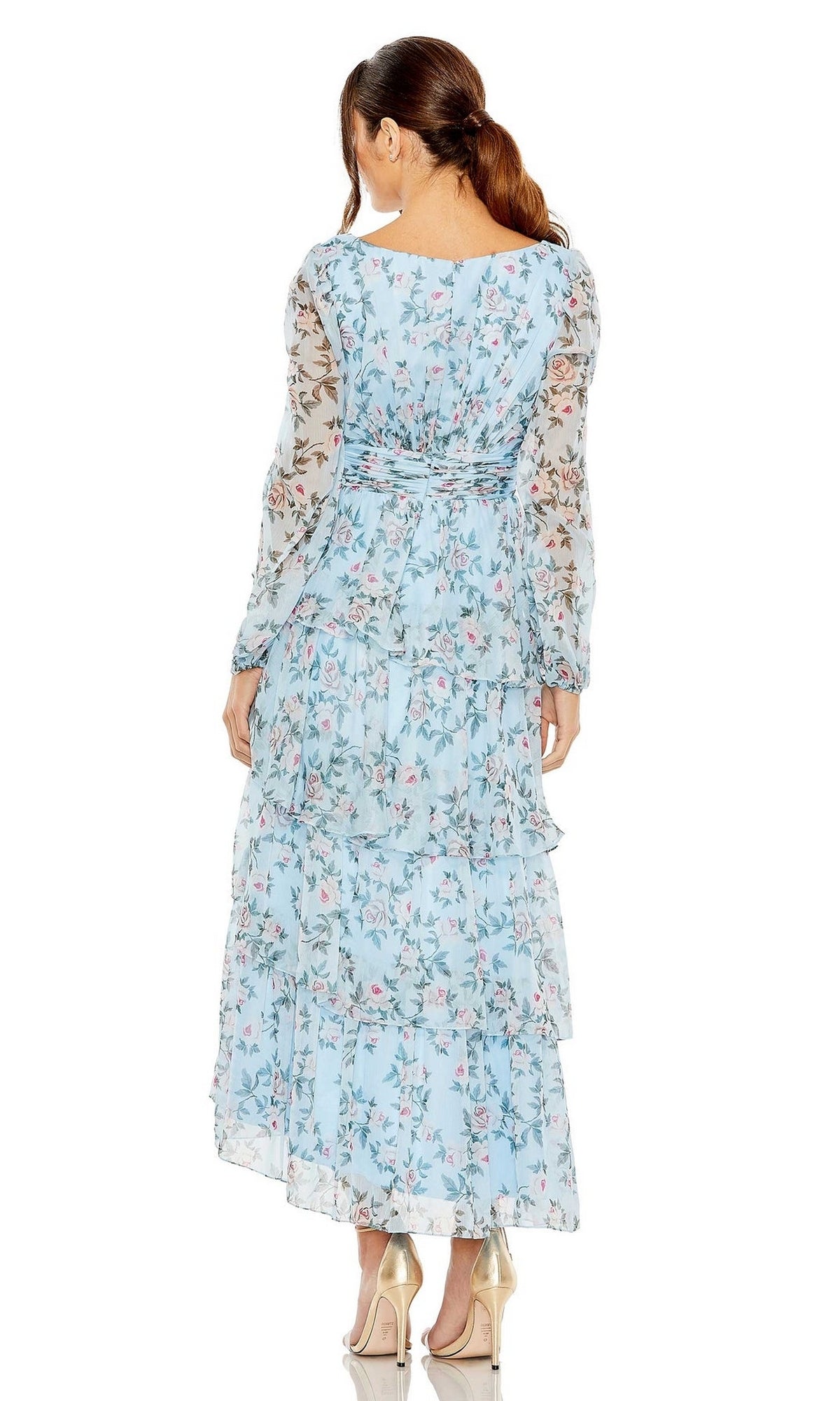 A woman with a ponytail wears the Mac Duggal 55880 Print Midi Wedding Guest Dress with long sleeves and tiered ruffles, sheer sleeves, and stands in heels with her back to the camera—an elegant option for wedding guests.