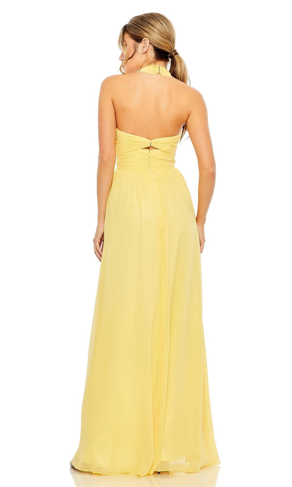 A woman wearing the Long Formal Dress 55898 by Mac Duggal, a strapless yellow floor-length A-line gown, is seen from the back with her hair in a low ponytail.
