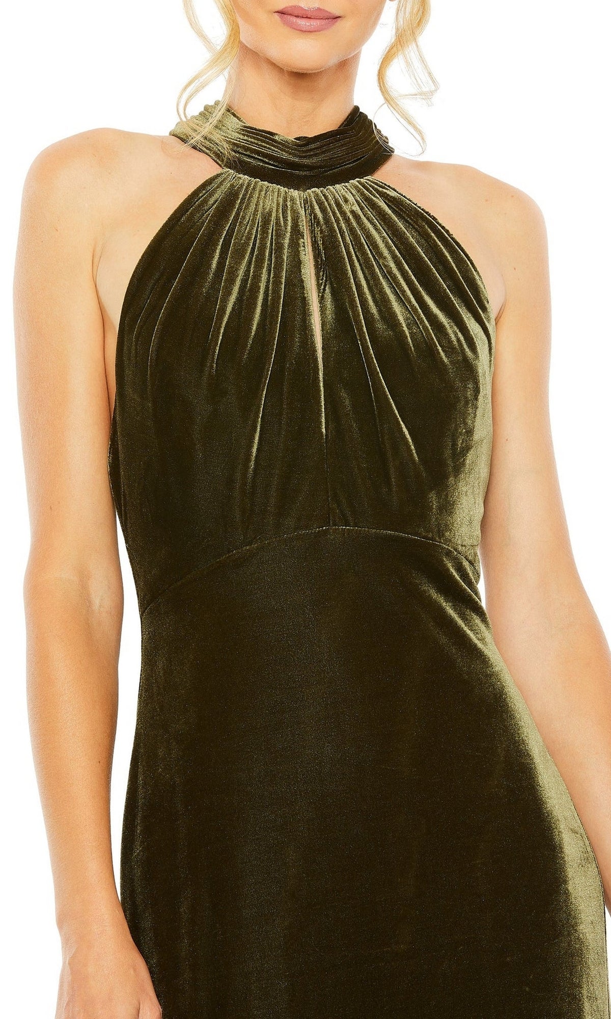 A woman wears the Long Formal Dress 55954 by Mac Duggal, featuring a sleeveless design in dark green velvet with a high gathered neckline and subtle pleats.