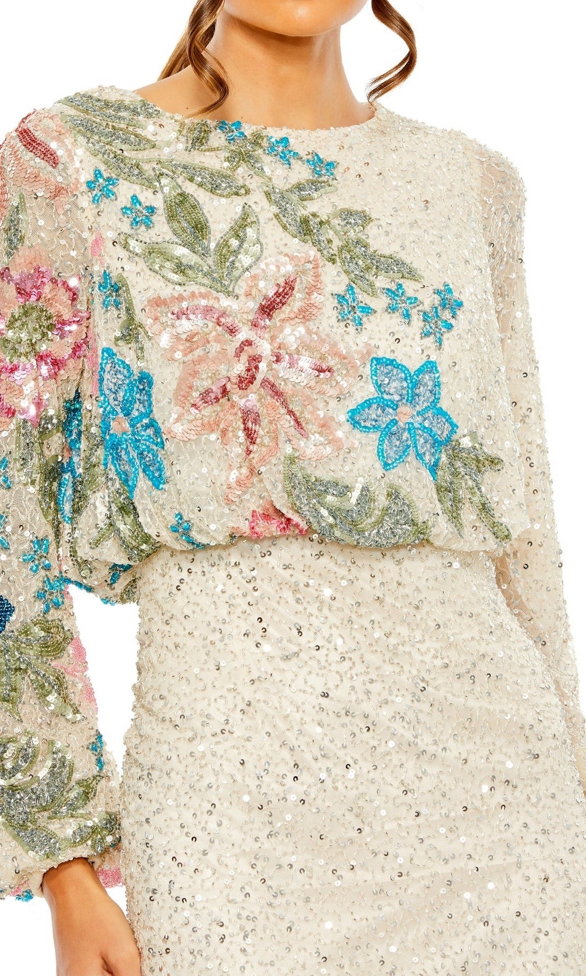 A woman wears the Mac Duggal 5615 Beaded Long Sleeve Formal Dress in cream, adorned with blue, pink, and green floral sequin embroidery on the top.