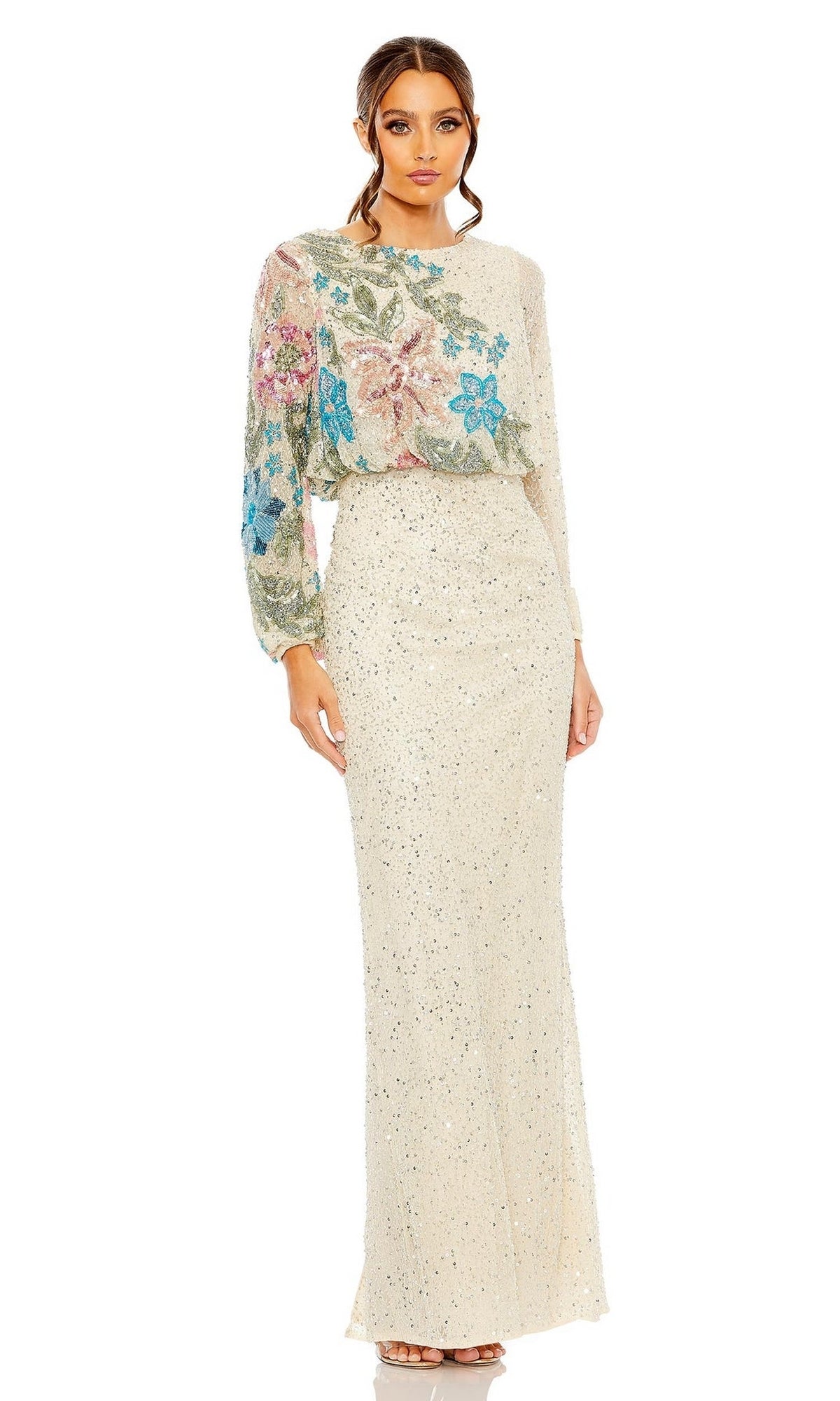 A woman wearing the Mac Duggal 5615 Beaded Long Sleeve Formal Dress in cream, accented with pink, blue, and green floral embroidery on the bodice.
