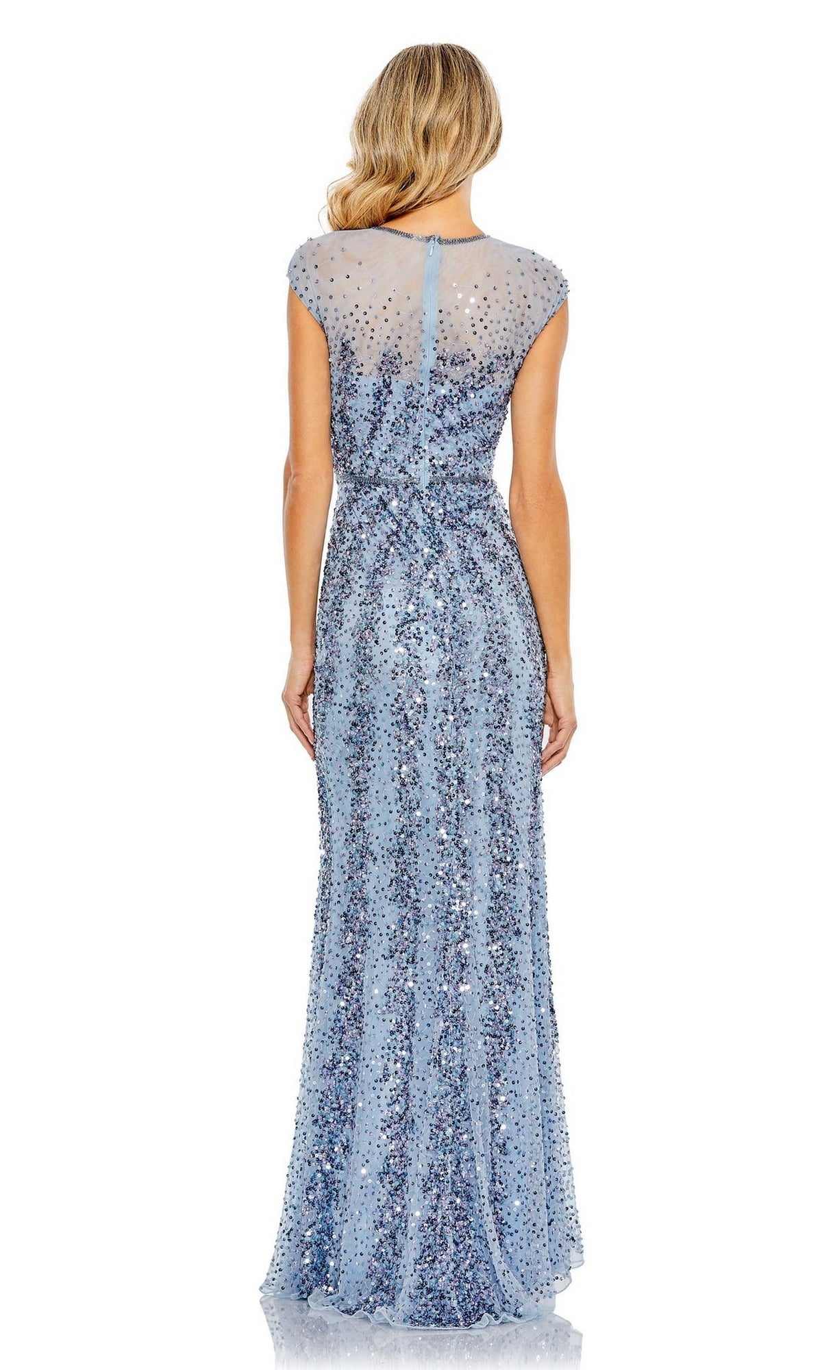 A woman with long, wavy blonde hair is seen from behind wearing the Mac Duggal 5619 sleeveless beaded long formal dress in light blue, featuring a sheer upper back.