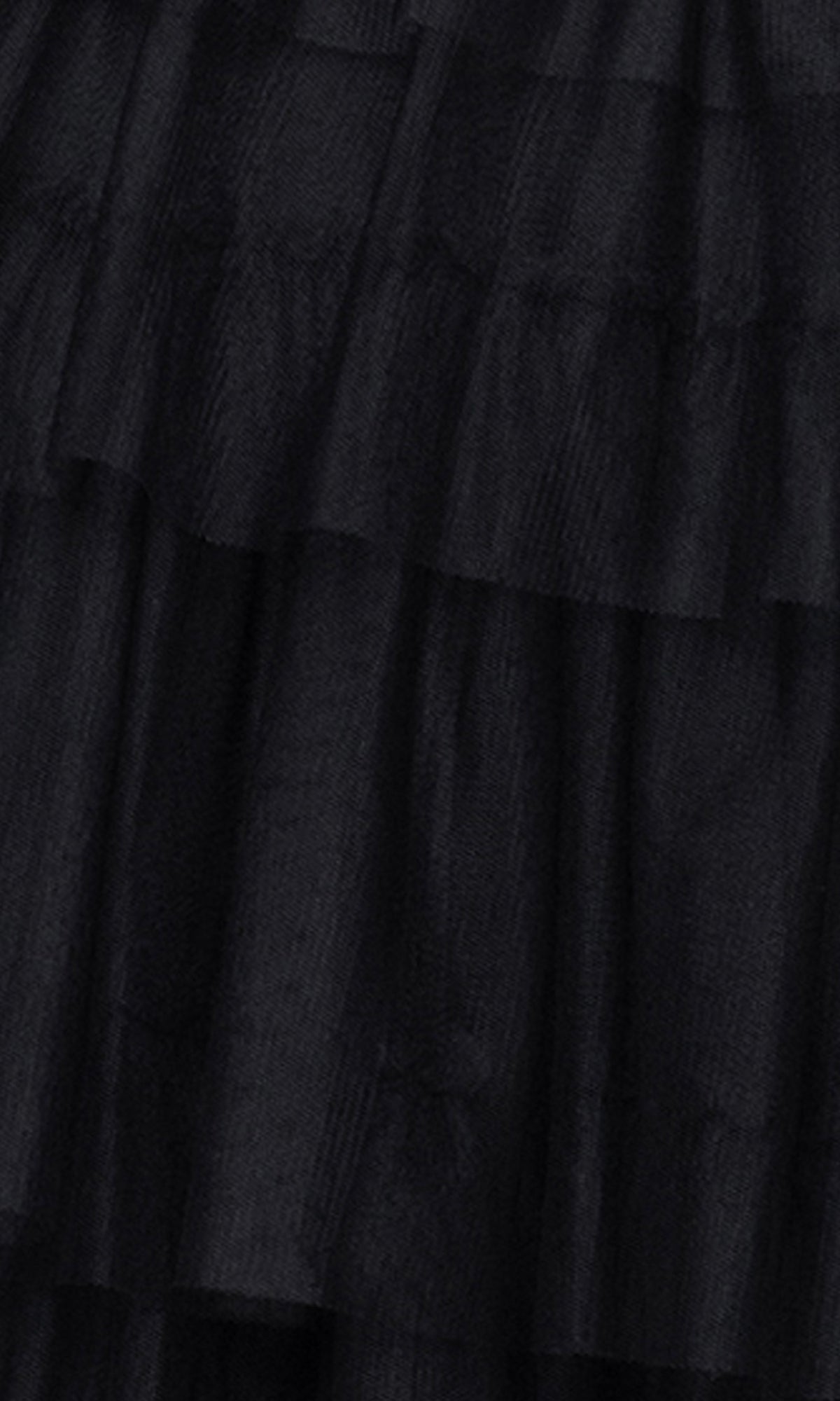Close-up of the Short Cut-Out Hoco Dress: Blondie Nites 5643BN—a black homecoming dress with sheer, textured fabric and ruffled tiers, highlighting its elegant layered design.