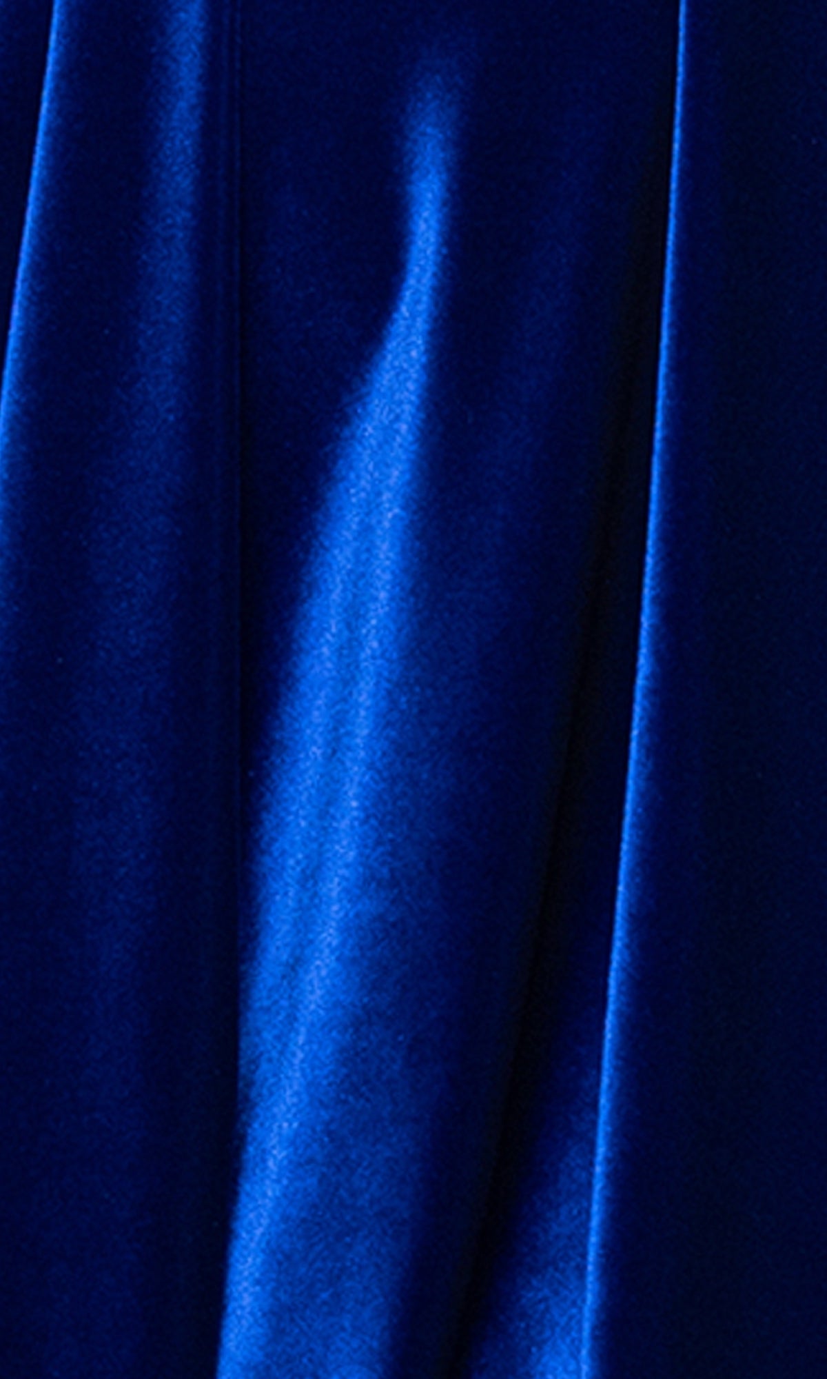 Close-up of royal blue velvet fabric with soft folds and a smooth, slightly shiny texture—ideal for the affordable Short Velvet Hoco Dress: Blondie Nites 5718BN, perfect as a chic cocktail or strapless homecoming dress.
