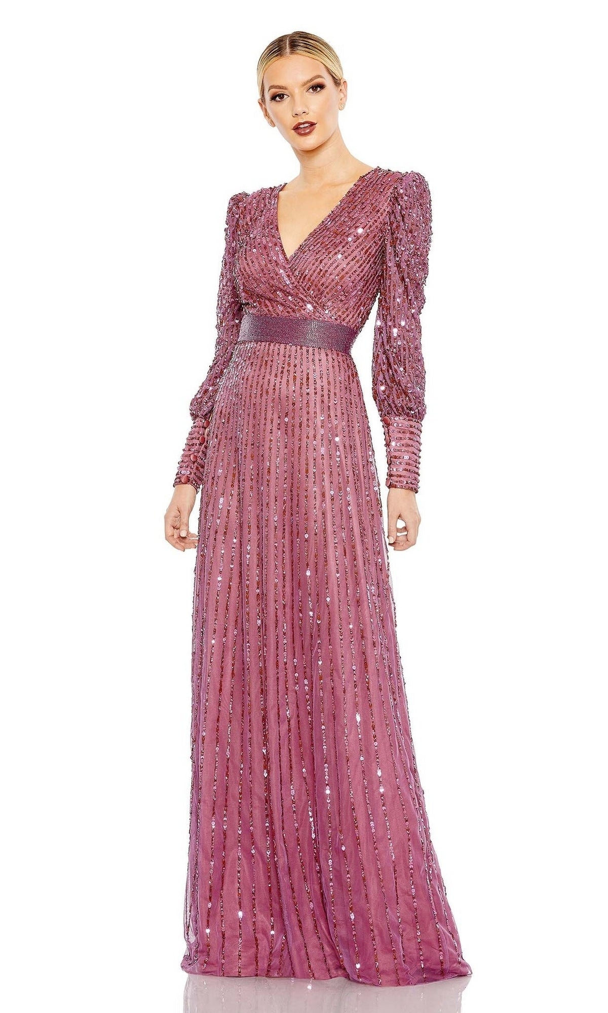 A woman wears the Mac Duggal 5720 Long Sleeve Sequin Formal Dress in mauve, featuring a V-neckline, fitted waistband, and pleated shimmering skirt—an elegant evening gown ideal for the mother of the bride.
