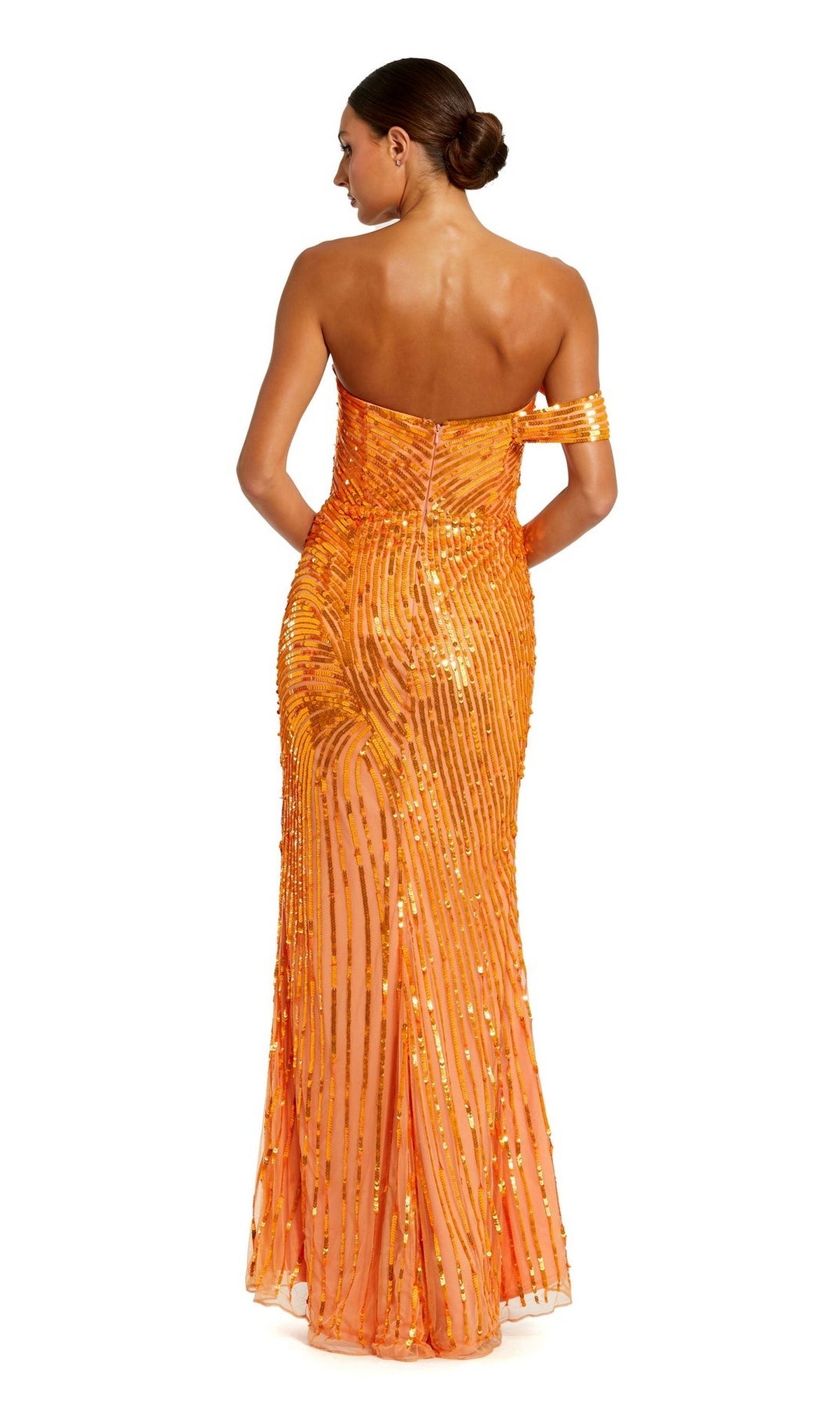 A woman with a low bun models the Long Formal Dress 6072 by Mac Duggal—an off-the-shoulder, orange sequin gown with a side slit—shown from the back against a white background.