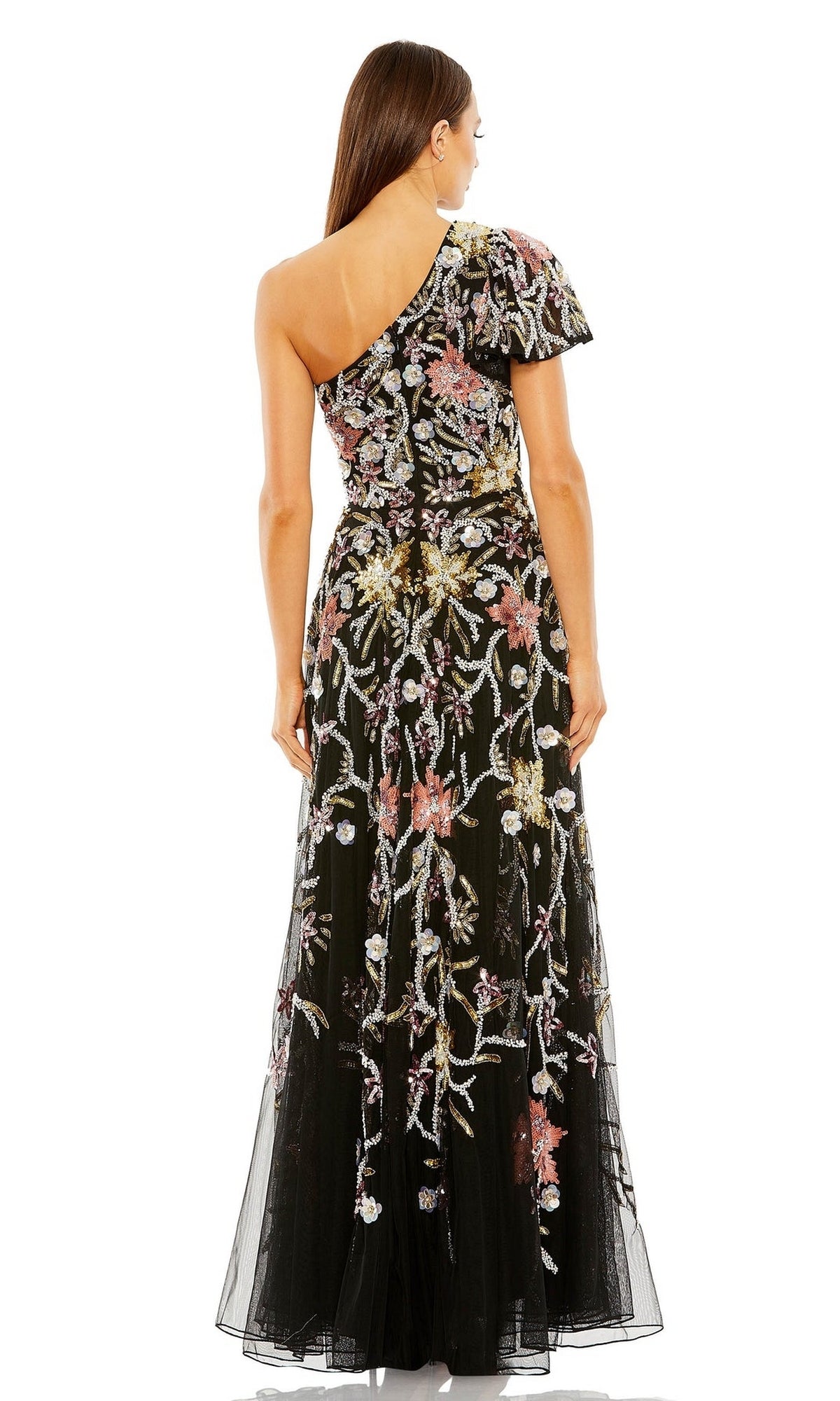 A woman is shown from the back wearing the Long Formal Dress 6134 by Mac Duggal, a stunning one-shoulder formal gown with black floor-length fabric and intricate floral beaded embroidery.