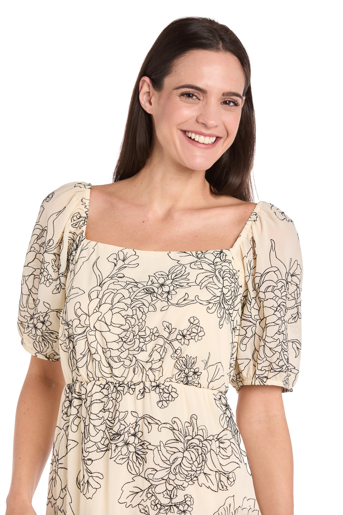 A woman smiles at the camera in the Petite Knee-Length Party Dress: R&M Richards 6688P against a plain white background.