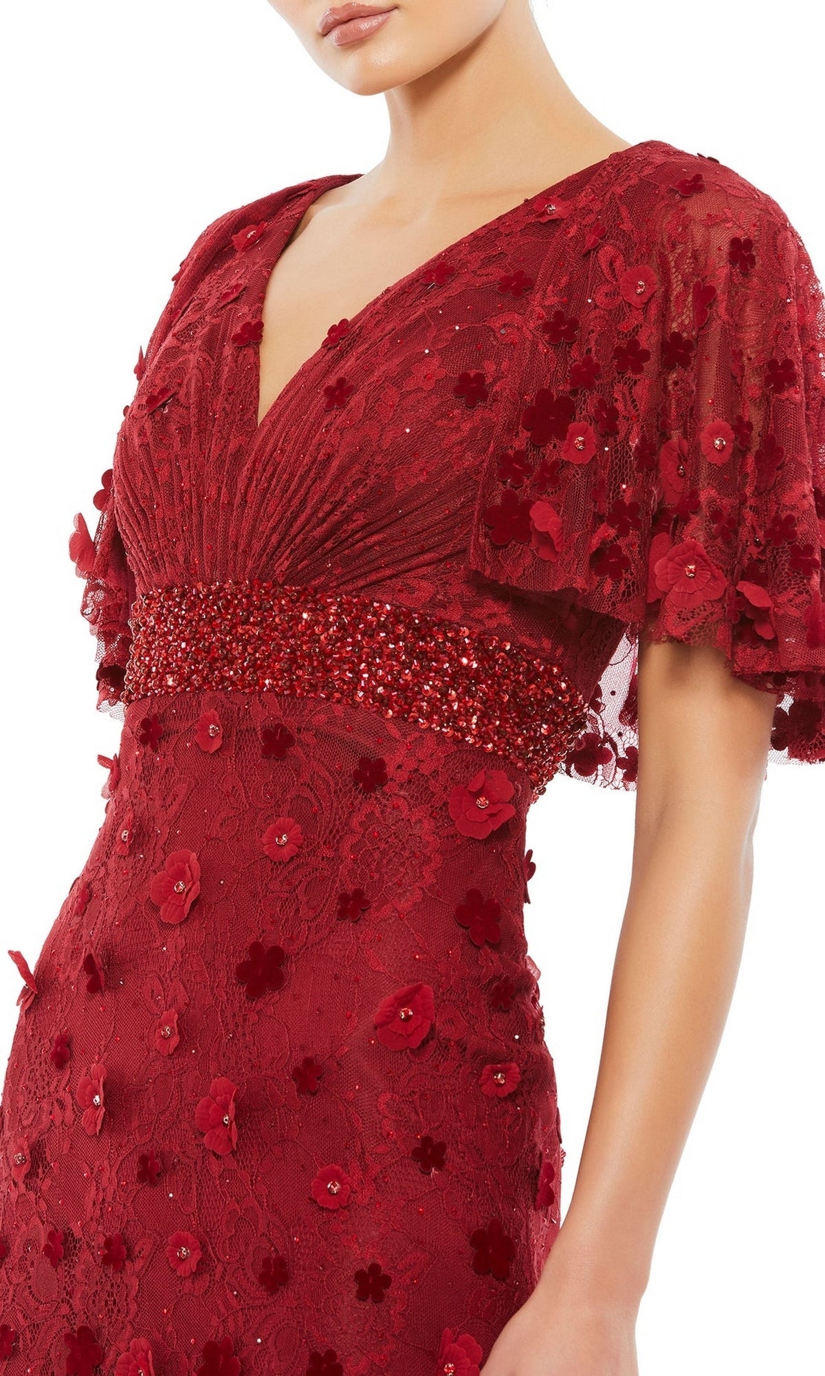 A woman wears the Mac Duggal 67712 Short-Sleeve Long Formal Dress in deep red with floral lace, a beaded waist, and flutter sleeves. The image is cropped below her nose.