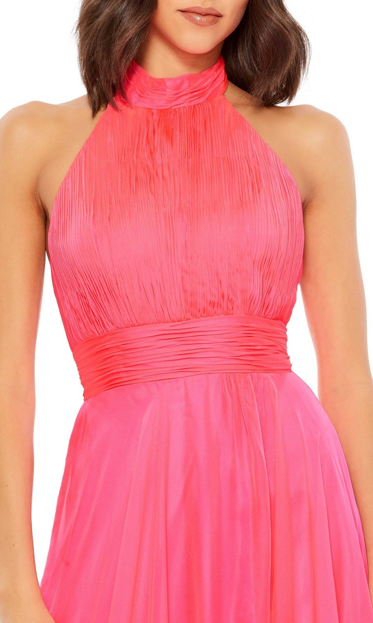 A woman wearing the Mac Duggal 67816 Open-Back Halter Formal Dress, a sleeveless, high-neck bright pink gown with pleats and a fitted waistband.