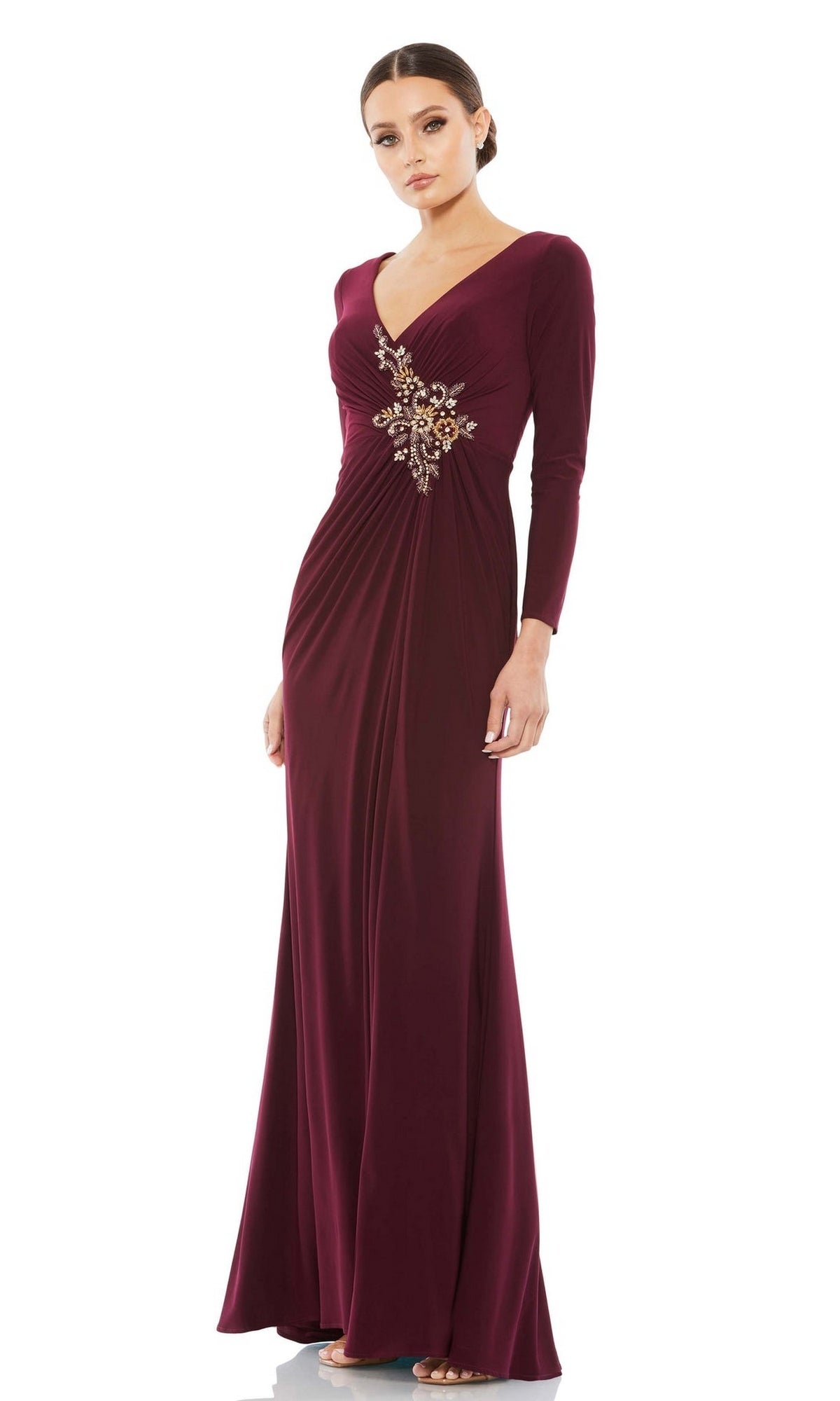 Elegant in the Mac Duggal 67848, a long sleeve formal dress with V-neckline, jeweled waist detail, and floor-length burgundy skirt—perfect for evening occasions.