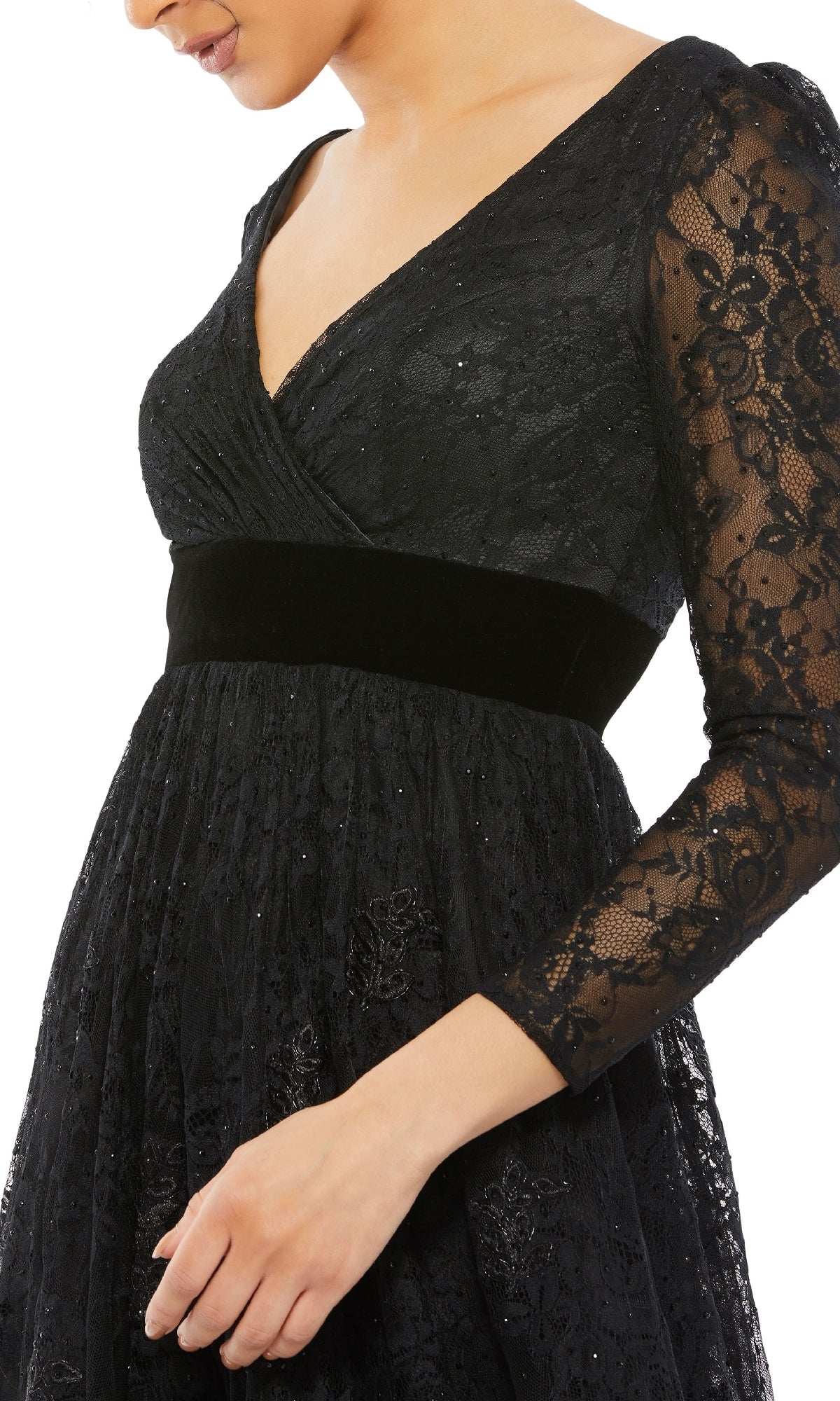 Someone wearing the Mac Duggal 67861 Long Black Lace Formal Dress featuring a V-neckline, velvet waistband, and floral lace—an elegant evening gown ideal for special occasions.