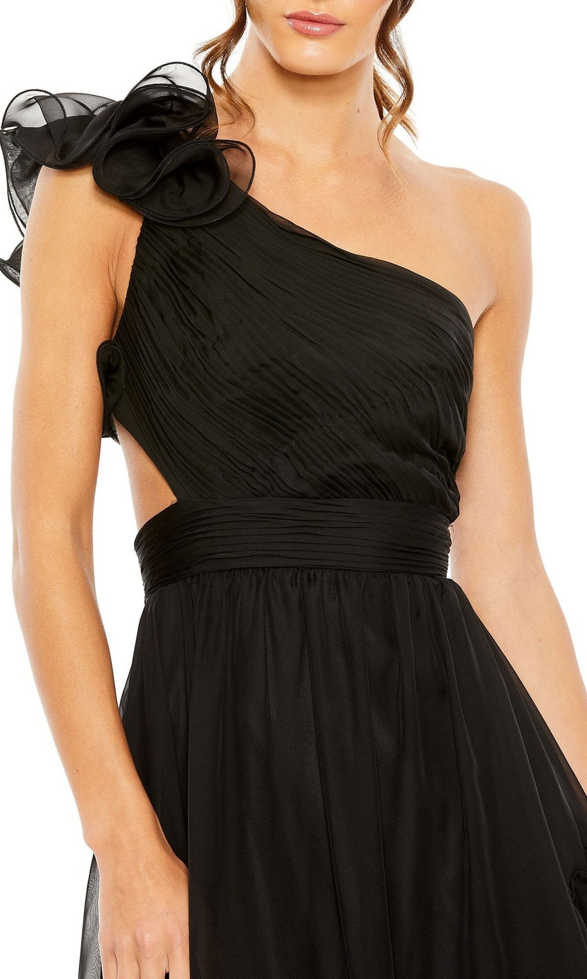 A woman wearing the Long Formal Dress 67989 by Mac Duggal, featuring one shoulder, pleated detailing, and a large fabric flower on the shoulder.